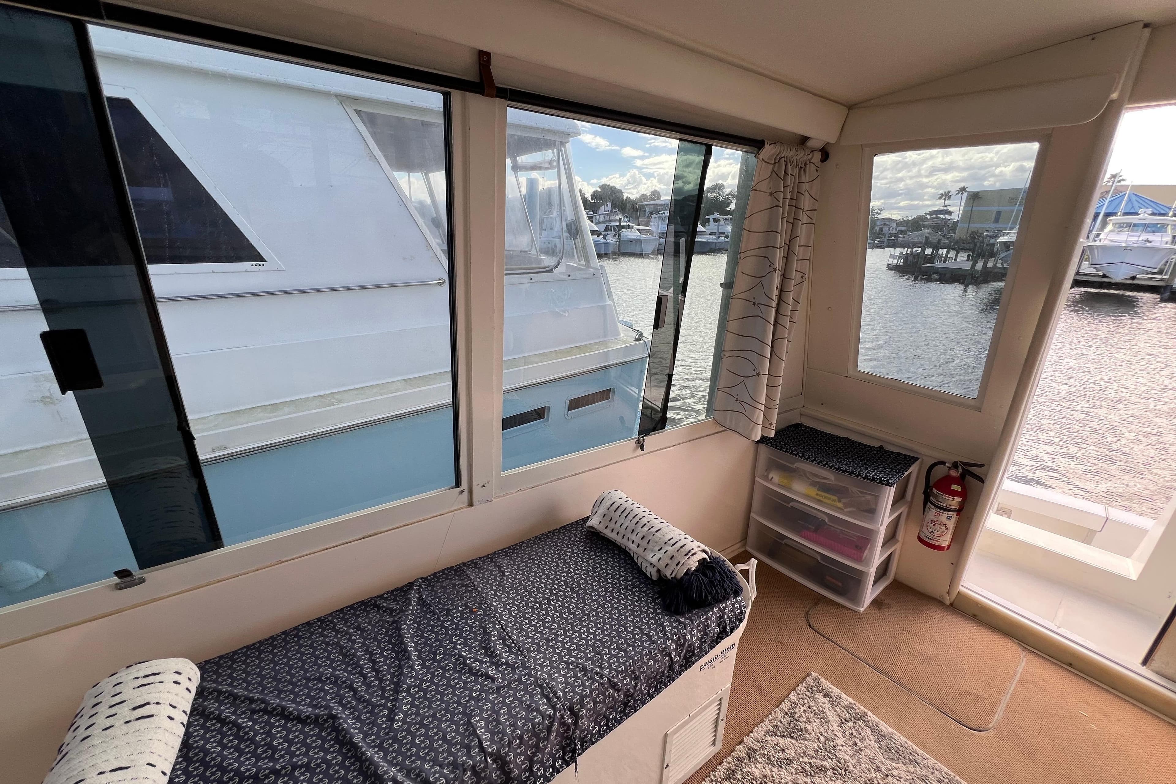 Interior view of a 1999 Viking 60 CPMY yacht with marina backdrop.
