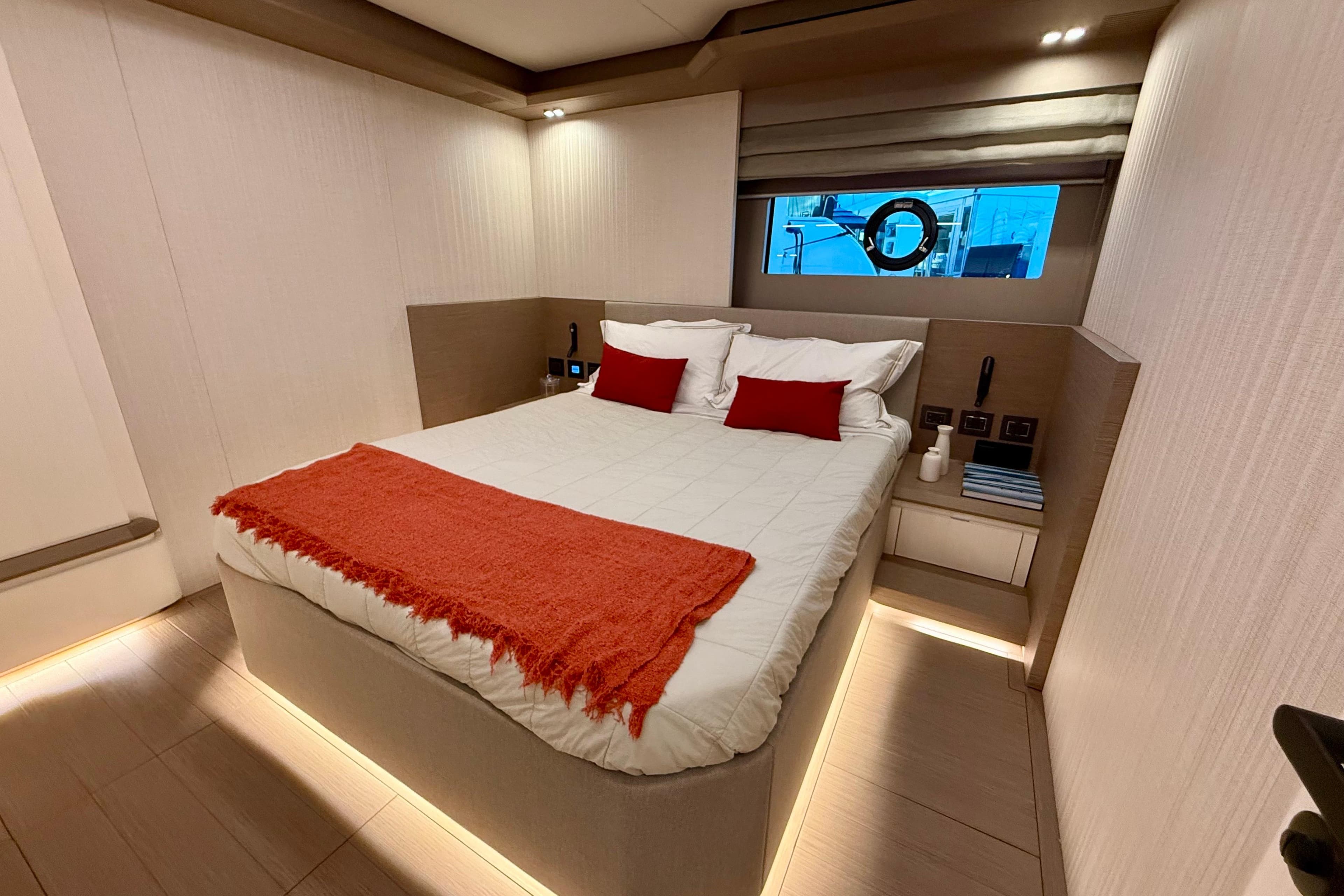 Luxurious bedroom interior of 2026 Pardo Yachts E72 with modern design and cozy bedding.