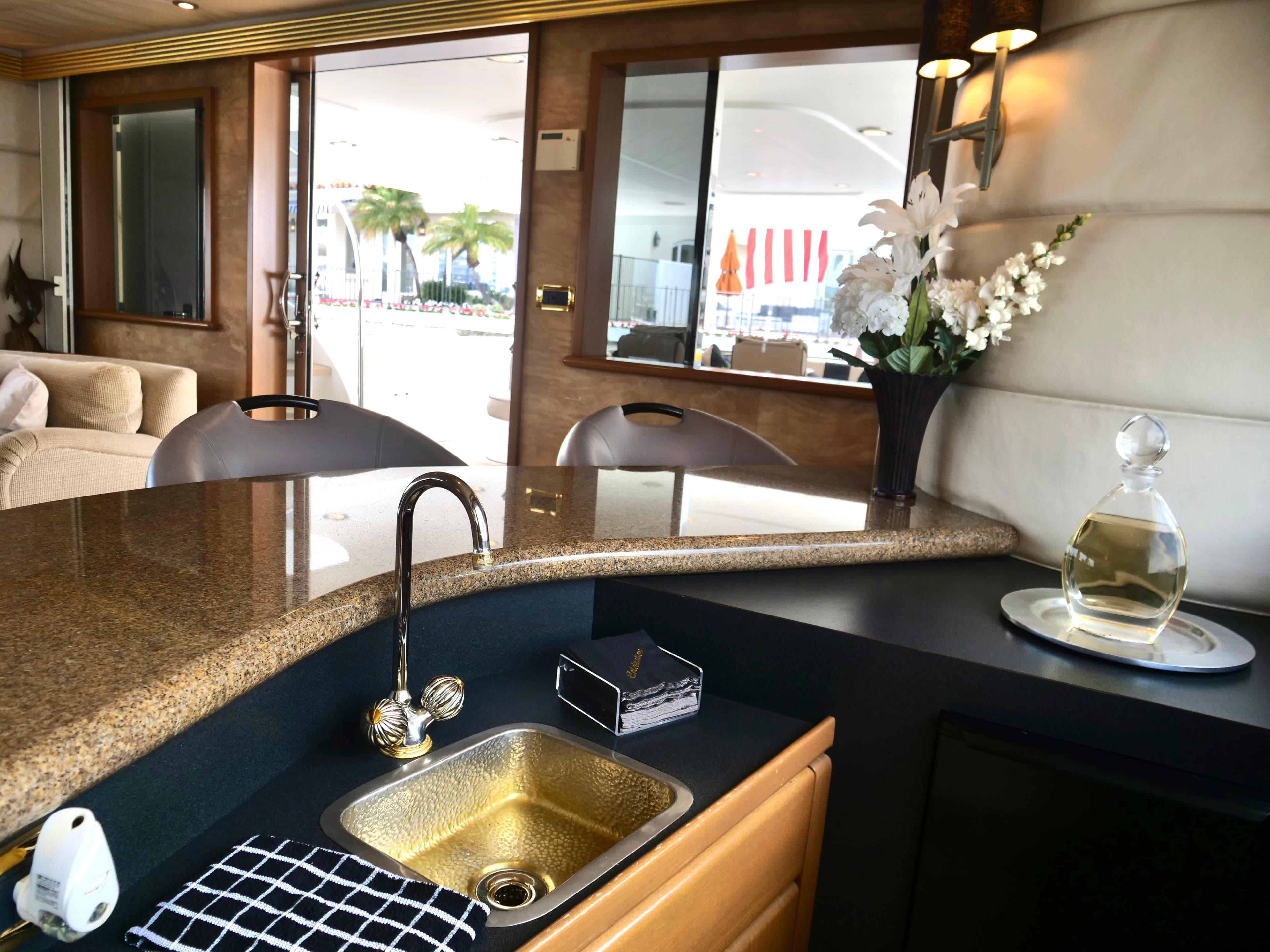Luxurious interior of 2000 Westport 112 yacht with elegant bar and modern amenities.