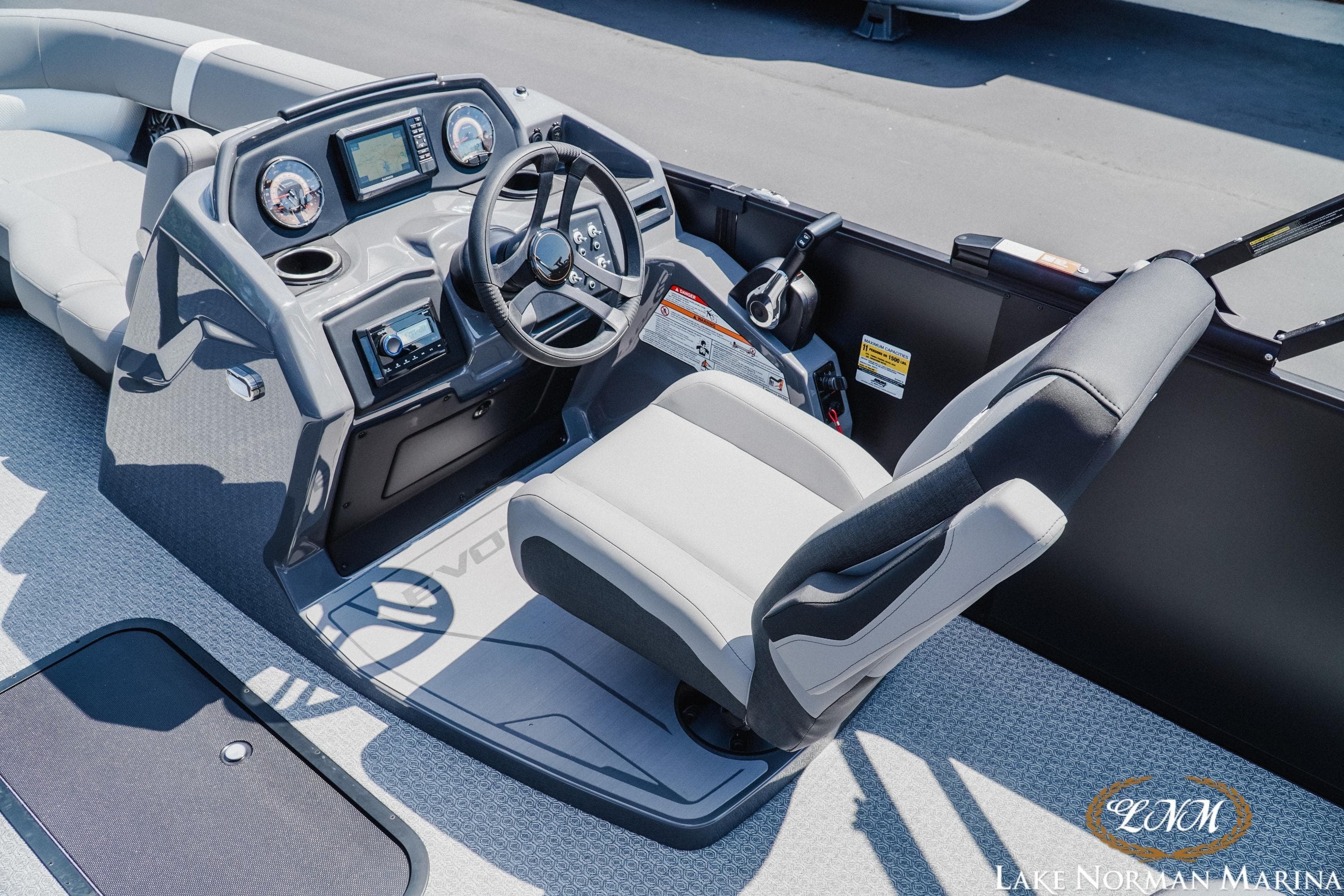 Cockpit of 2026 Evotti 521CS boat with modern controls and comfortable seating.