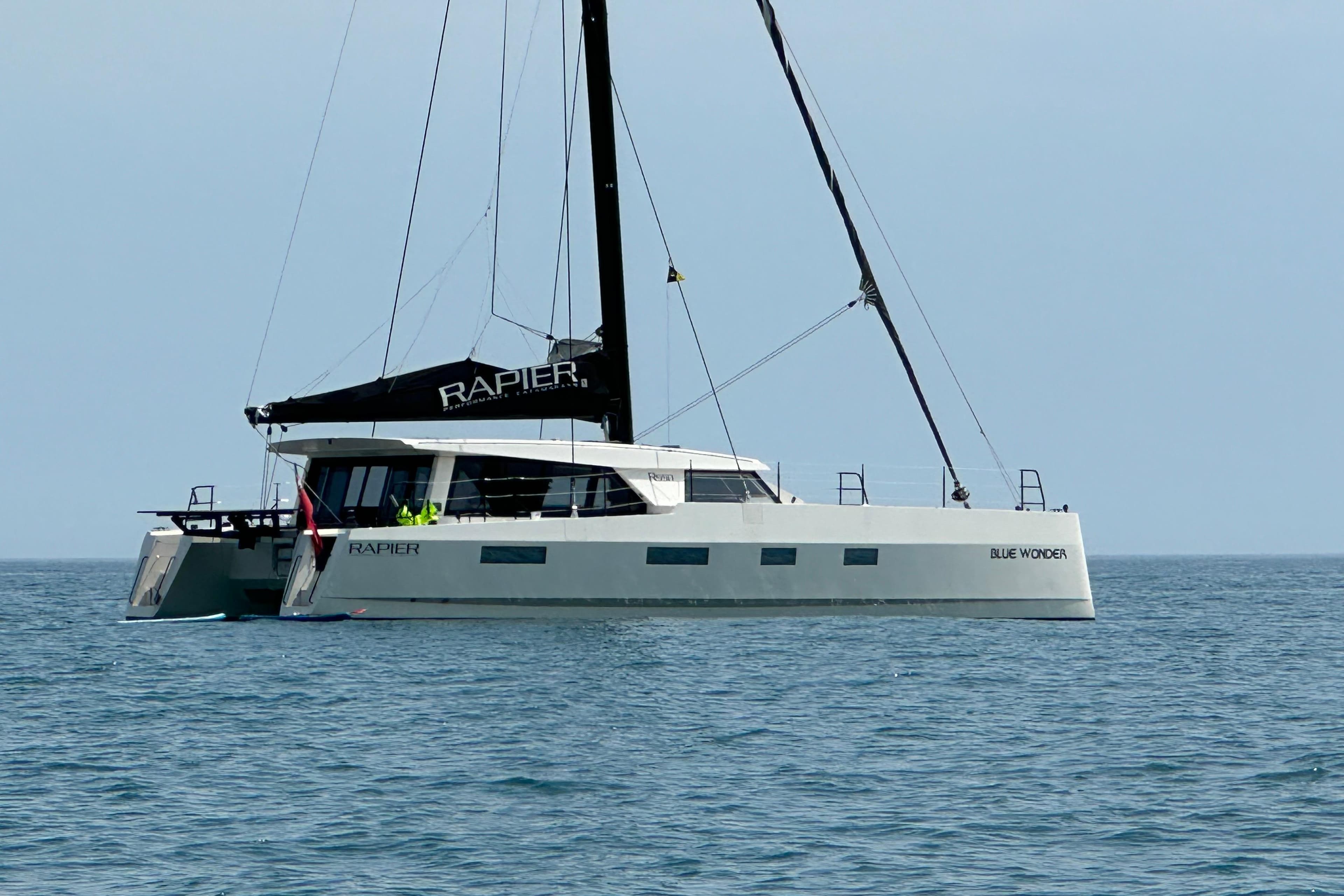 2015 Rapier 550 catamaran "Blue Wonder" sailing on calm ocean waters.