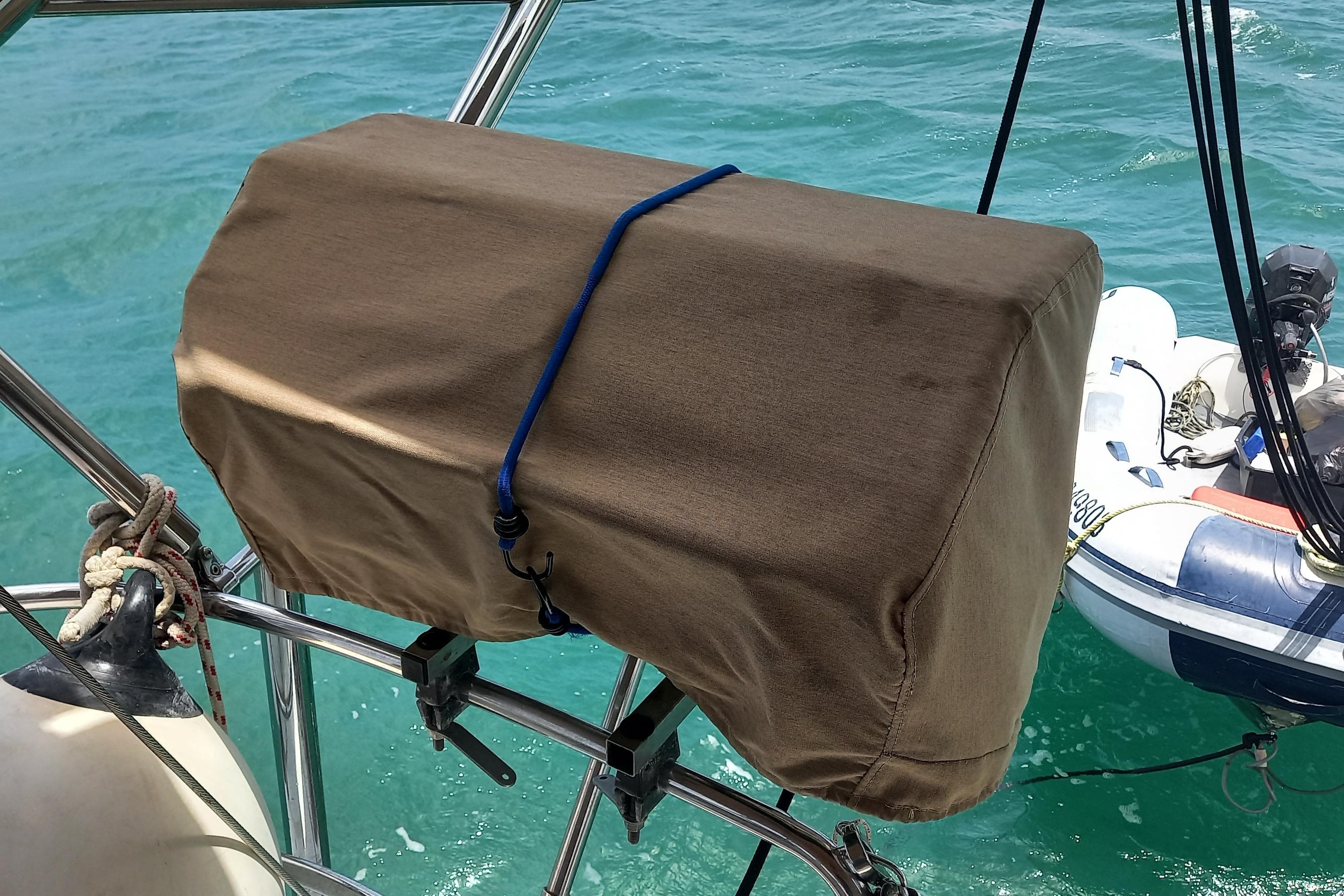 Protective cover on Jeanneau Sun Odyssey 45 DS sailboat, 2011 model, with ocean backdrop.