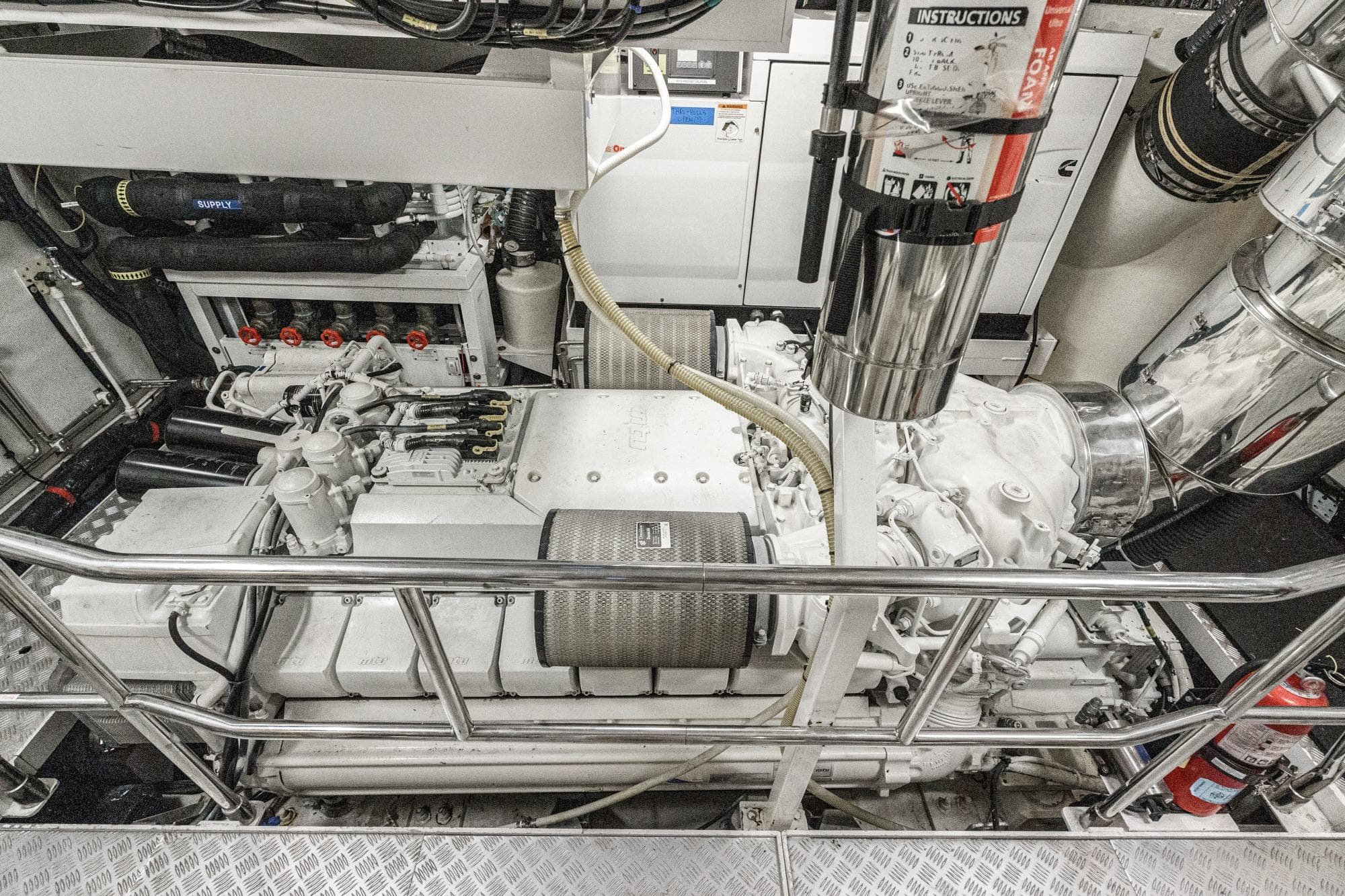 Engine room of a 2011 Princess 95 Motor Yacht, showcasing machinery and equipment.
