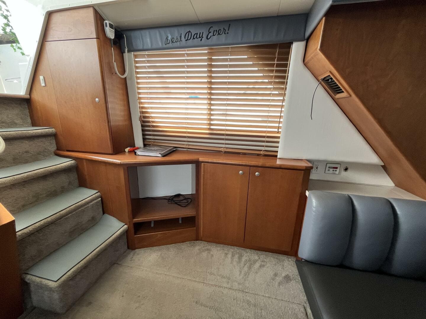 Interior of 1996 Silverton 372 Signature yacht with wooden cabinets and stairs.