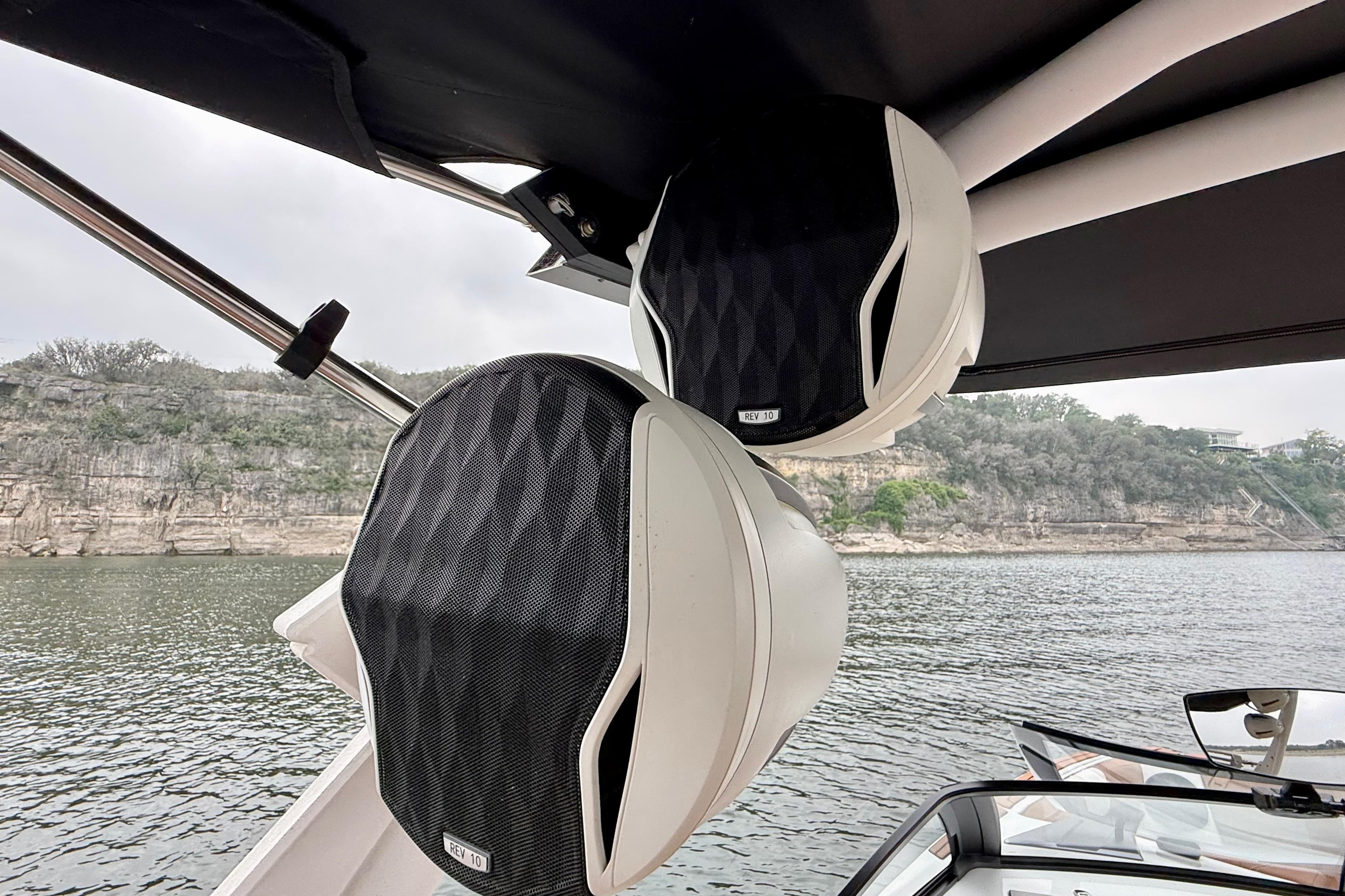 2023 Malibu Wakesetter 24 MXZ boat speakers with scenic lake backdrop.