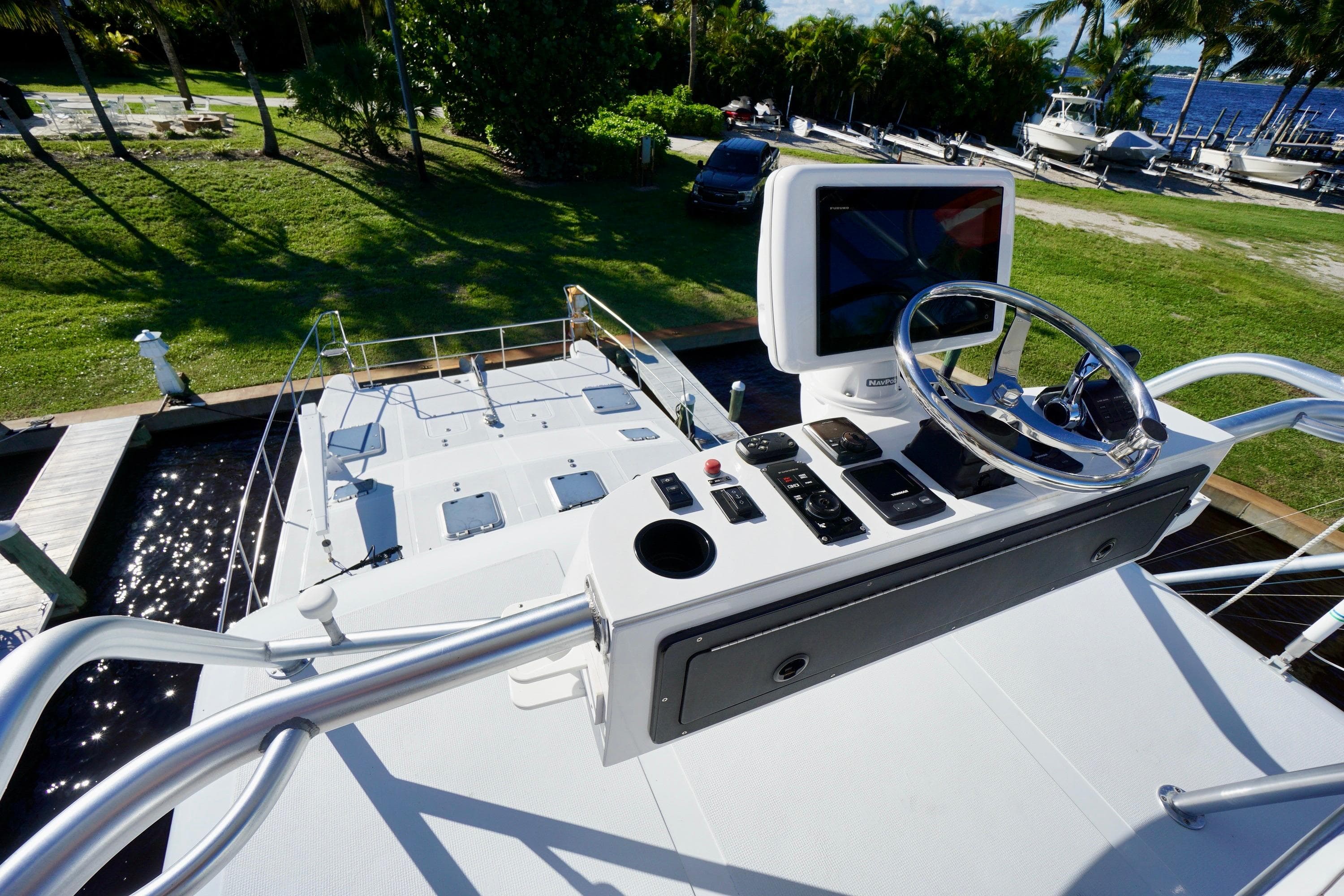 Helm of 2000 Venturer 44 yacht with steering wheel and control panel.