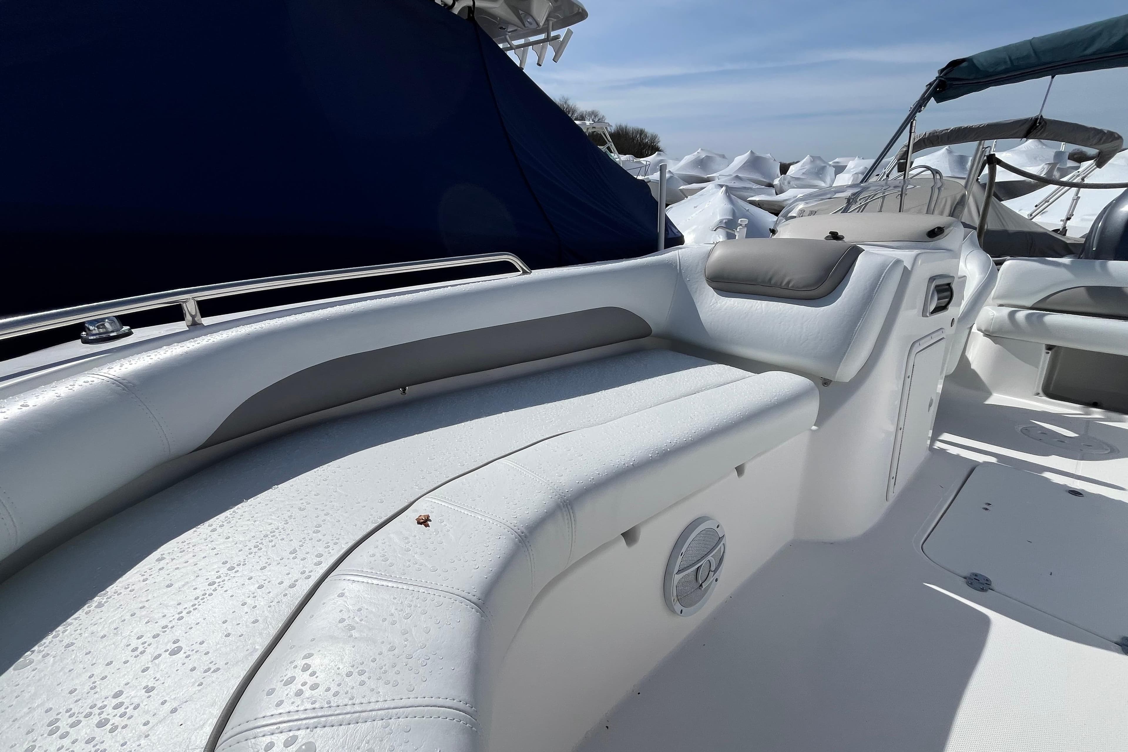 2015 Hurricane SunDeck Sport 201 OB boat interior with white seating and sleek design.