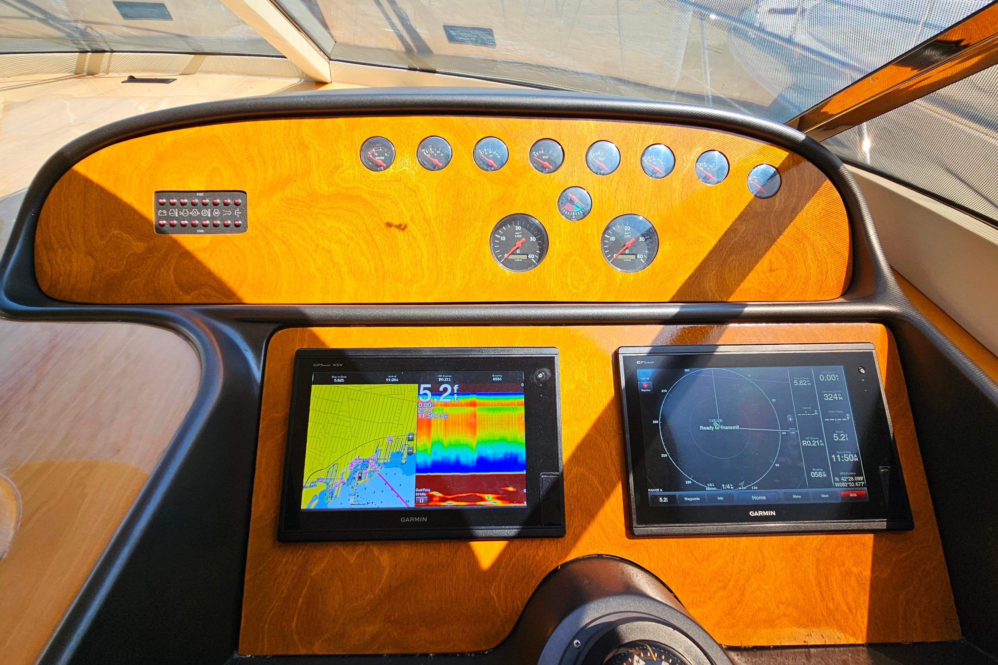 Control panel of a 1998 Sunseeker Manhattan 62 yacht with navigation screens.
