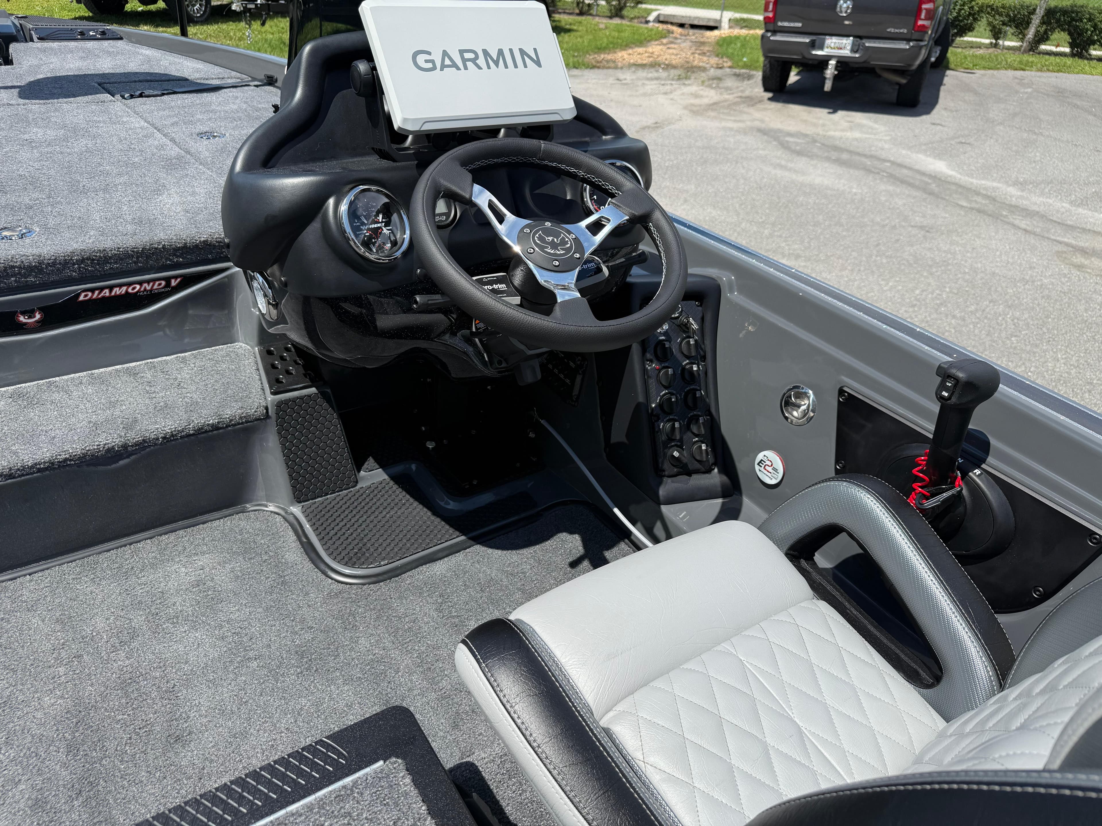 2026 Phoenix 721 ZXL boat interior with Garmin display and steering wheel.