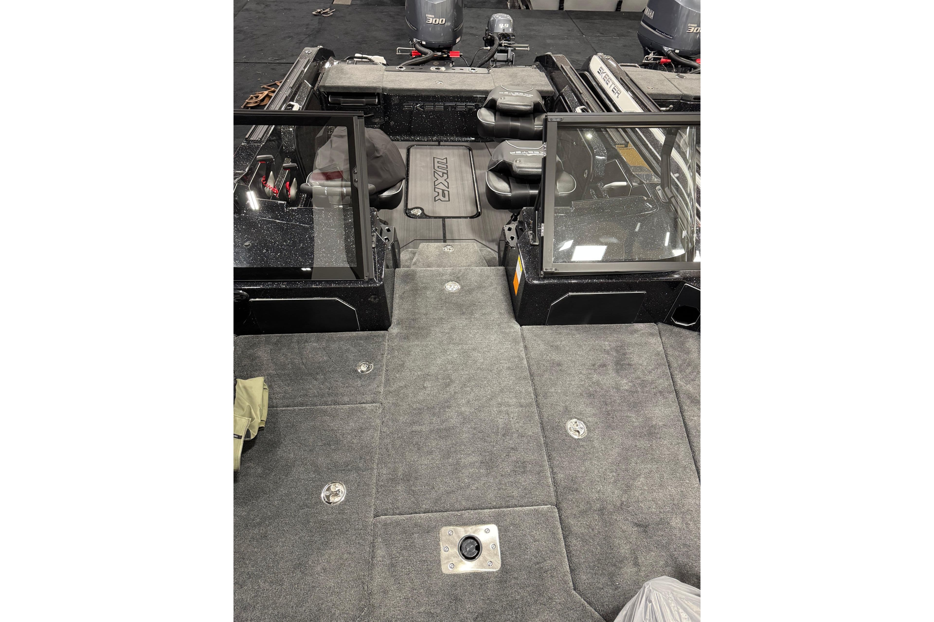 2026 Skeeter WXR2060 F boat interior with carpeted deck and seating area.