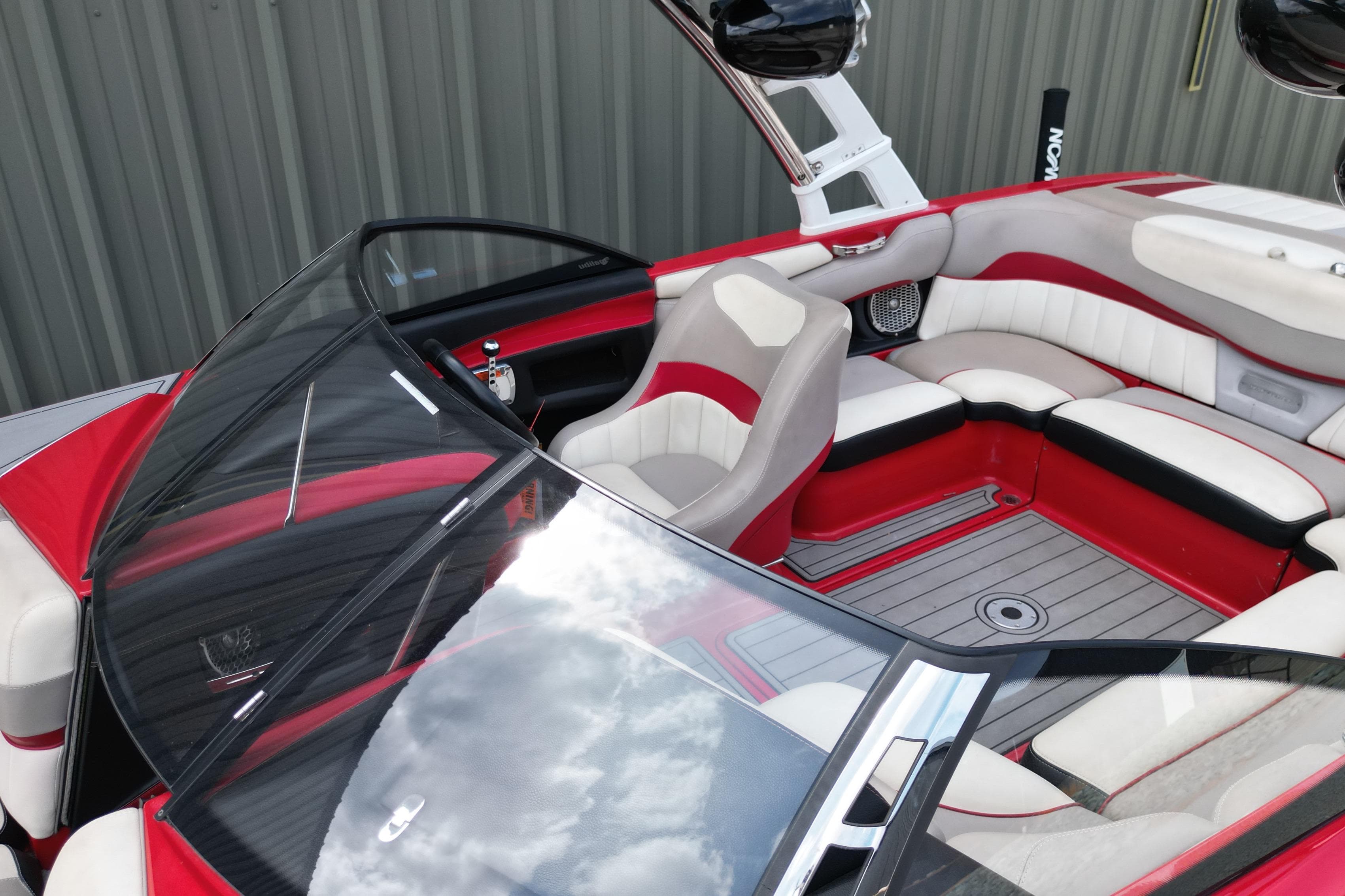 2012 Malibu Wakesetter 22 MXZ interior with red and white seating, sleek design.