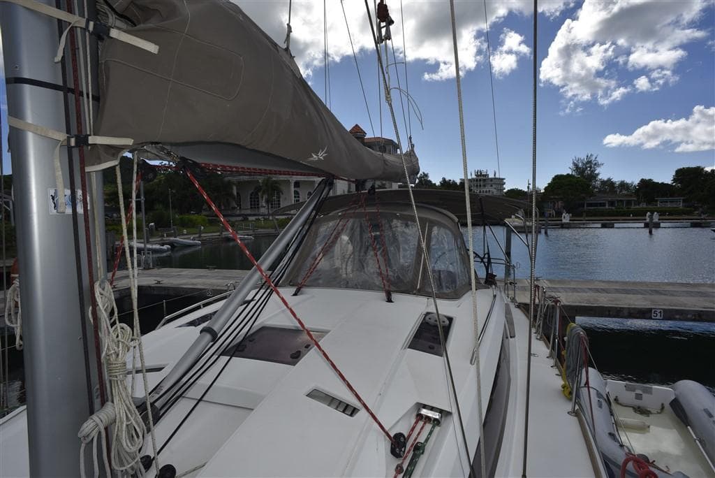 Jeanneau Sun Odyssey 41 DS 2013 sailboat docked under cloudy sky.
