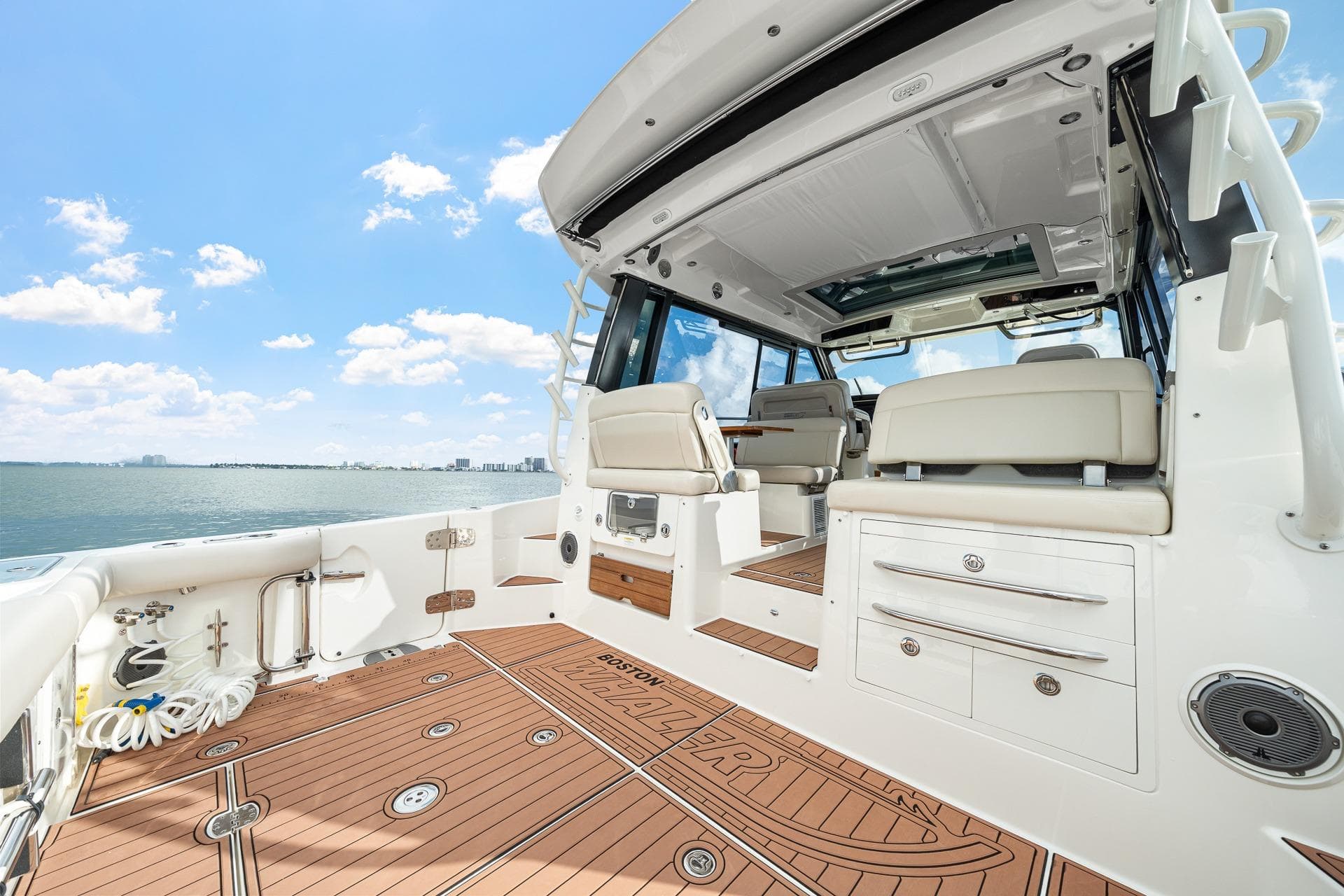 2024 Boston Whaler 405 Conquest boat interior with luxurious seating and ocean view.