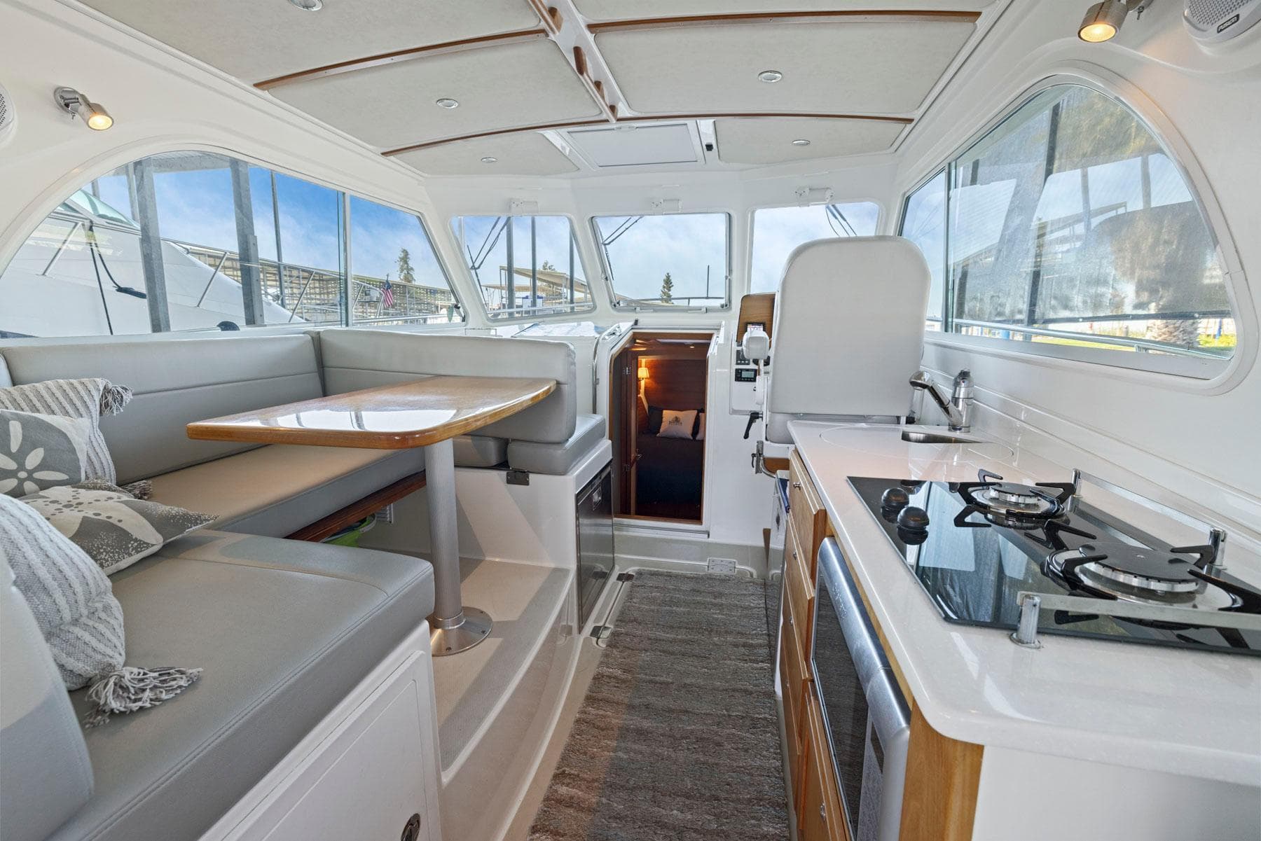 Interior of 2018 Back Cove 32 yacht with modern kitchen and dining area.