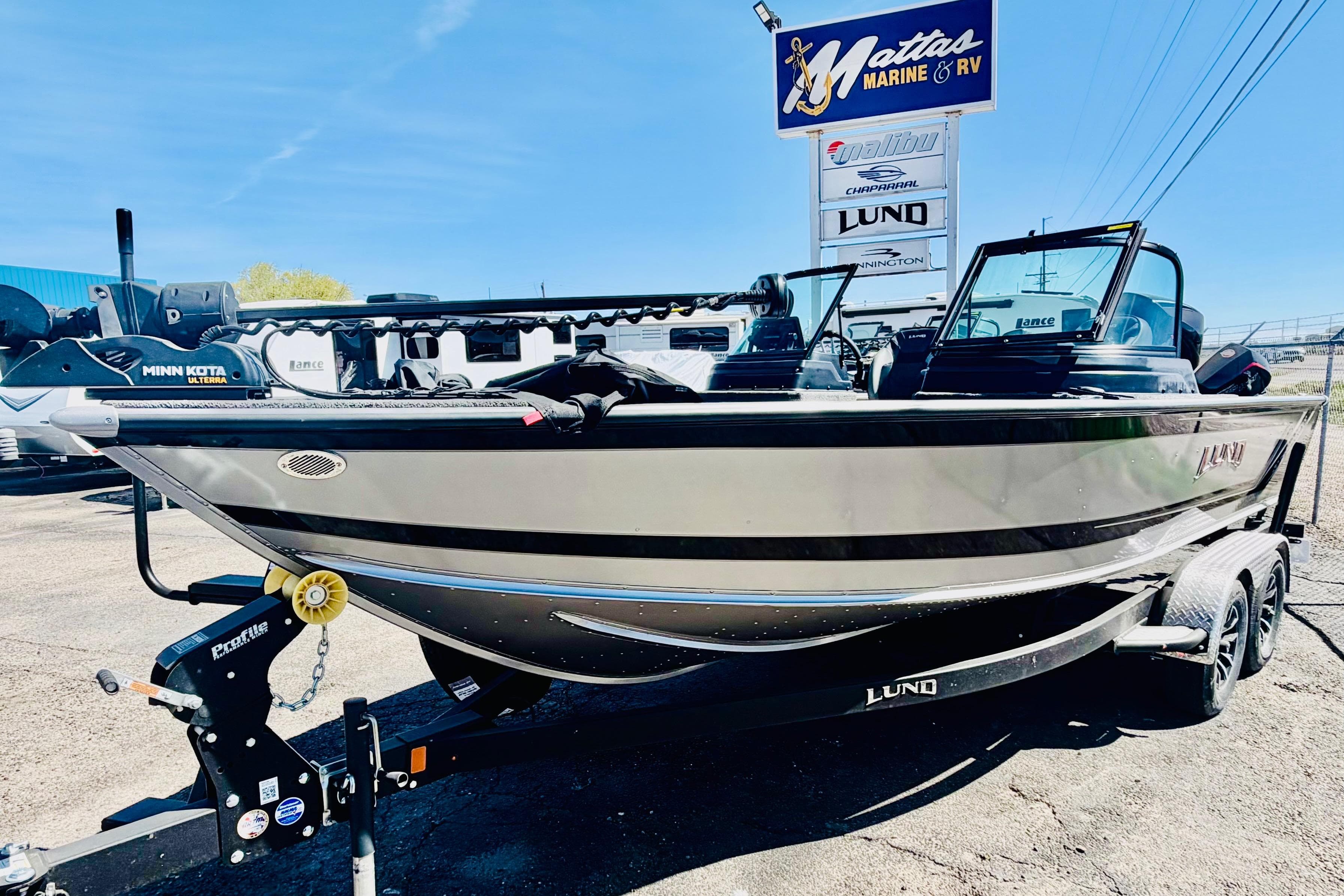 2026 Lund 2075 Impact XS boat on trailer at Mattas Marine & RV dealership.