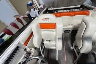 2021 Velocity 290 Sport Cruiser interior with white and orange seating.