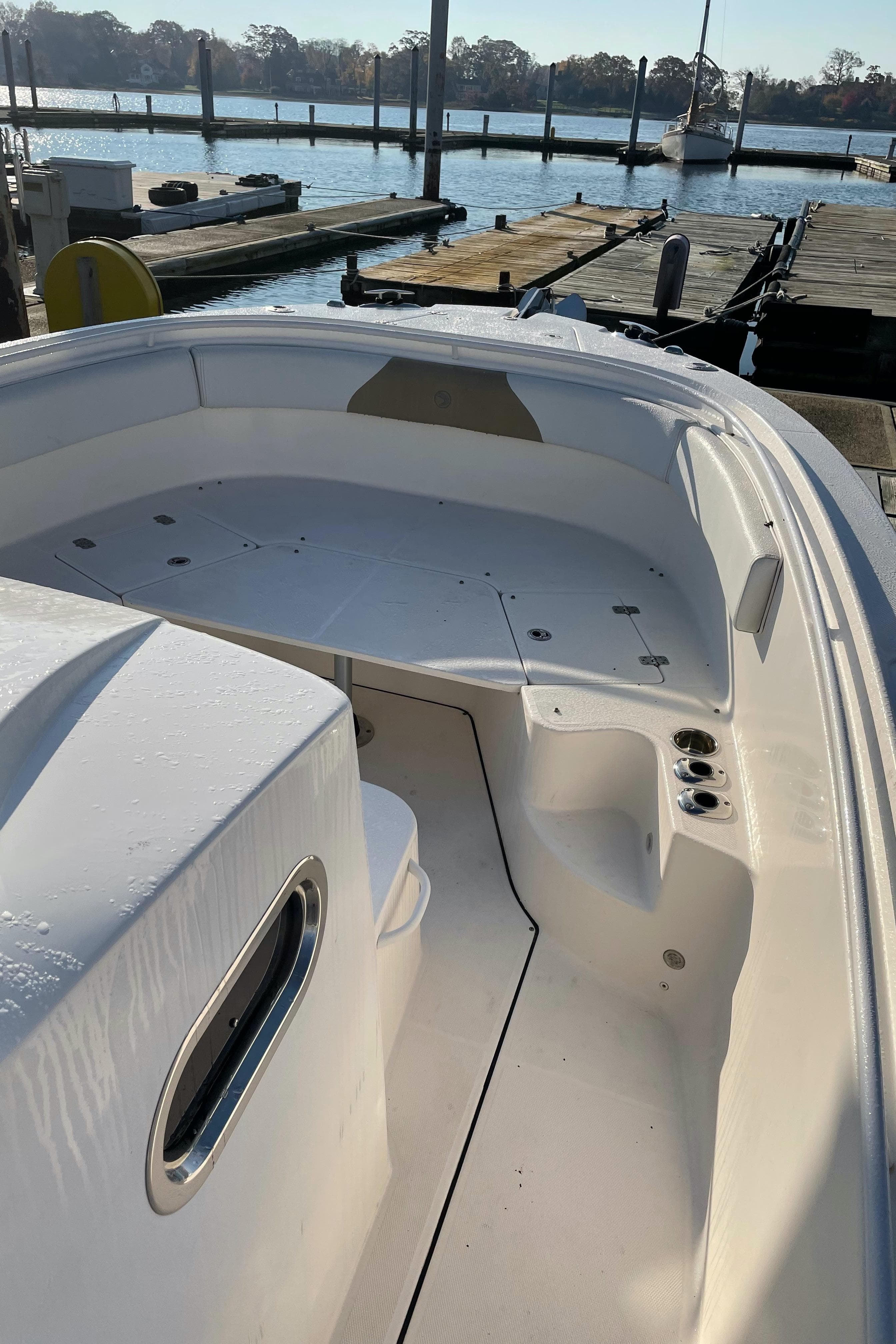 2015 Edgewater 280CC boat docked at marina, sunny day.
