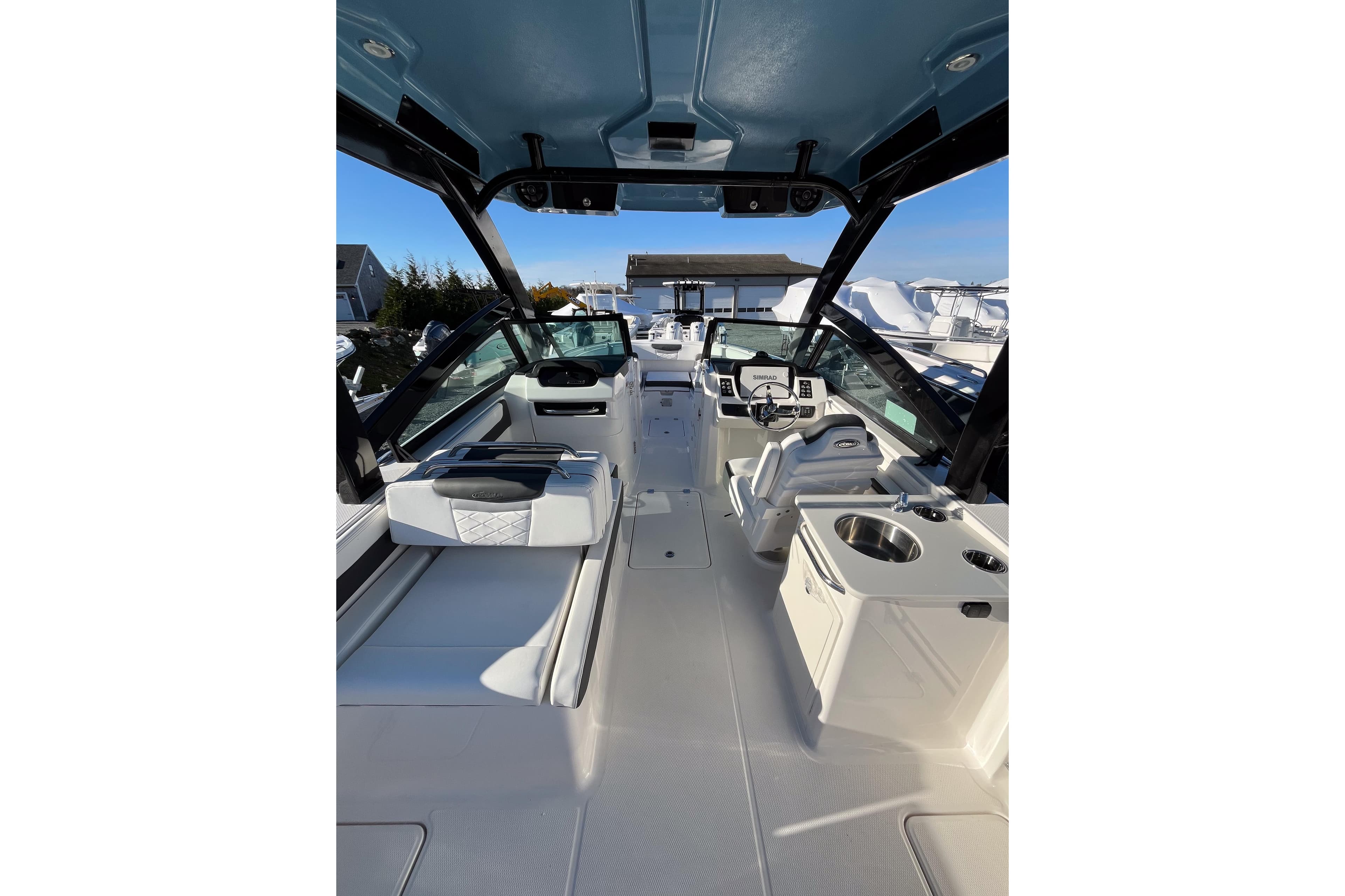 2026 Robalo R257 Dual Console boat interior with seating and helm station.