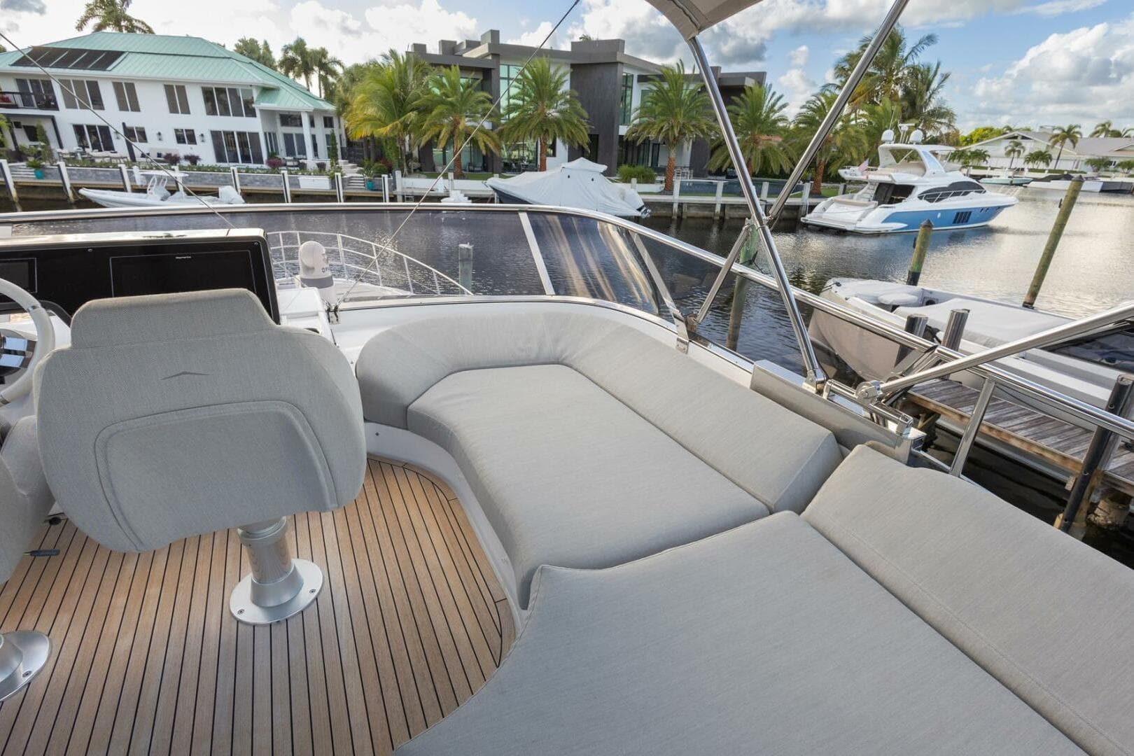 2023 Azimut S6 Sport-Fly yacht with luxurious deck seating and marina view.