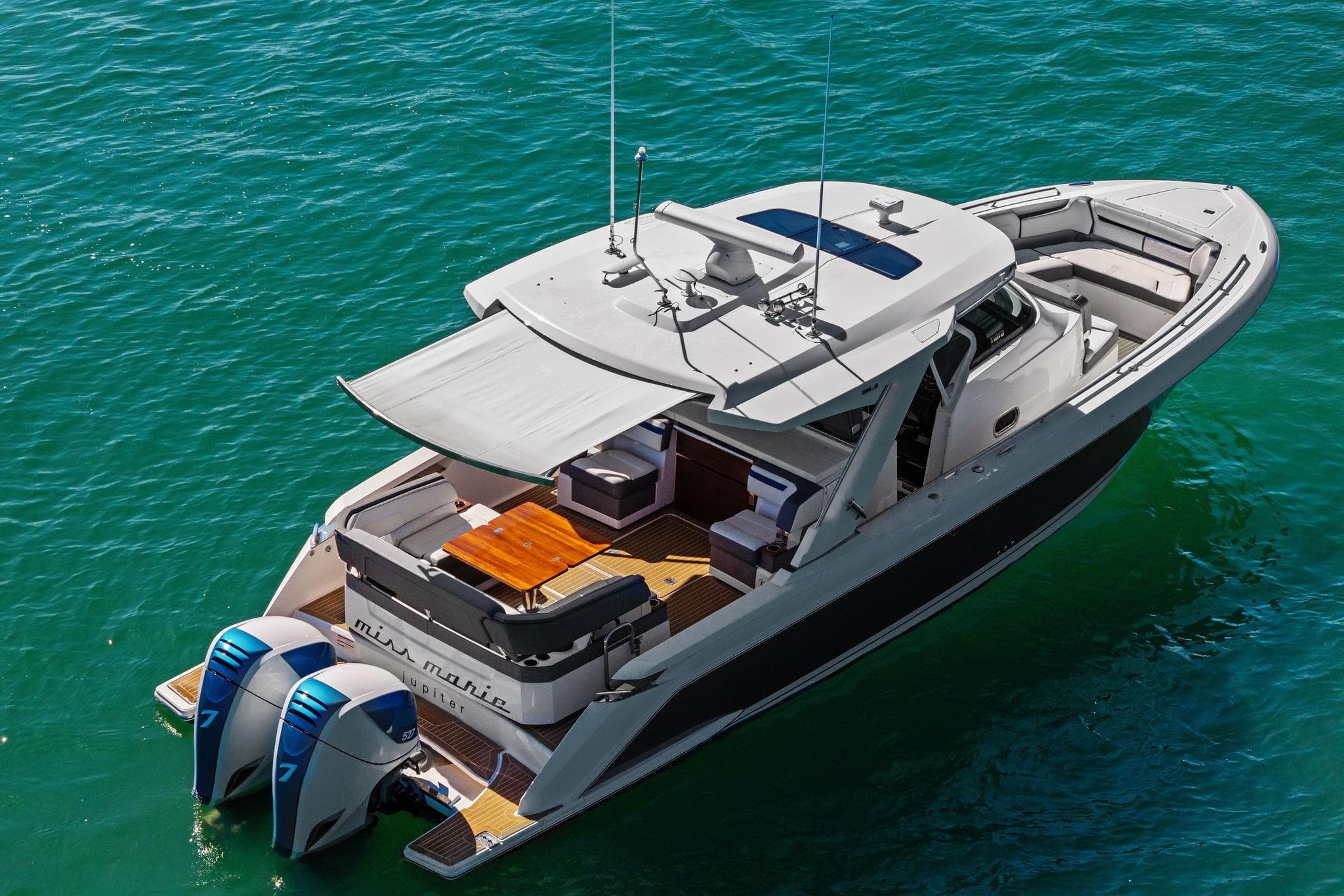 2019 Tiara Yachts 38 LS luxury boat on clear blue water.