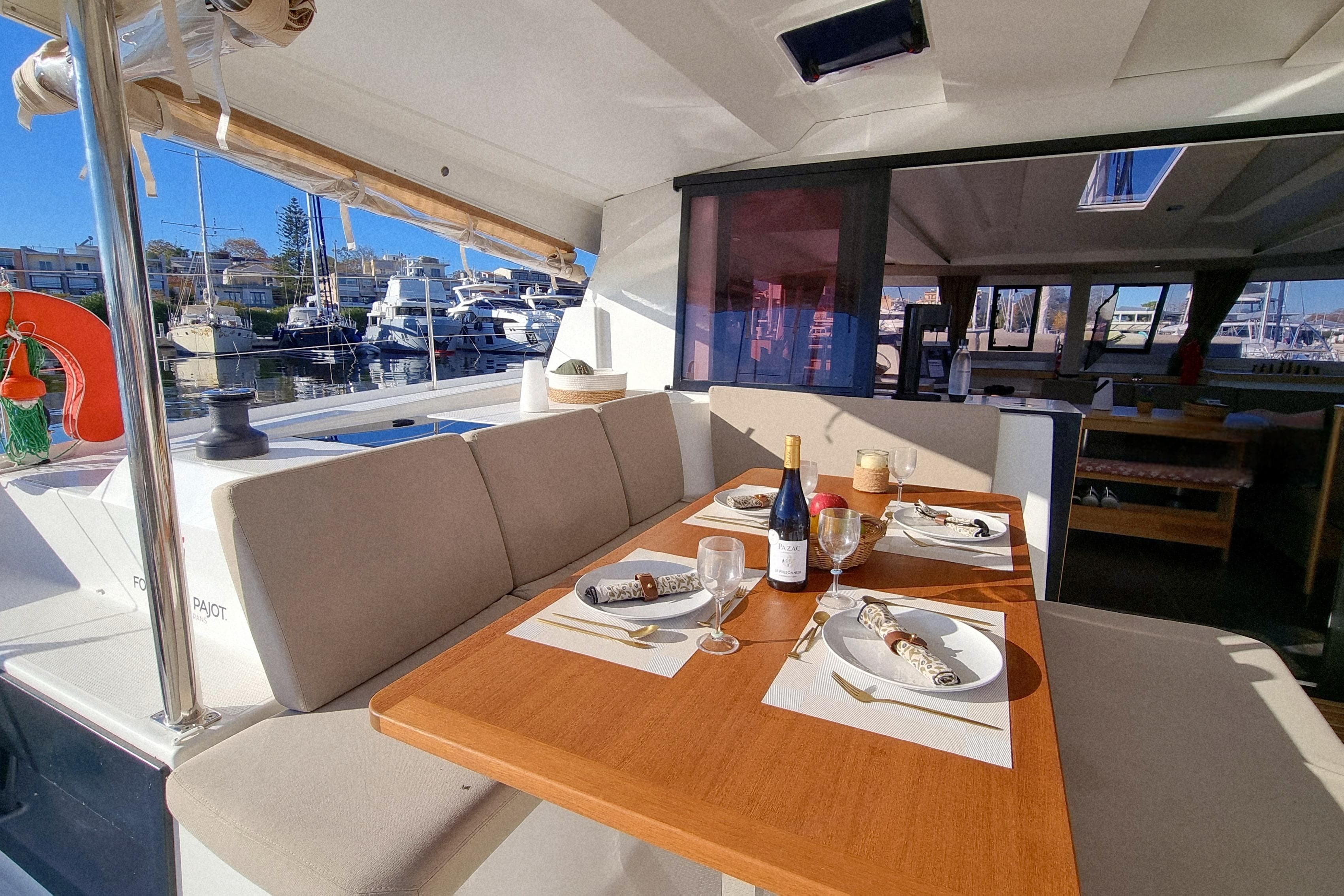 2024 Fountaine Pajot Astrea 42 Catamaran interior dining area with elegant table setting.
