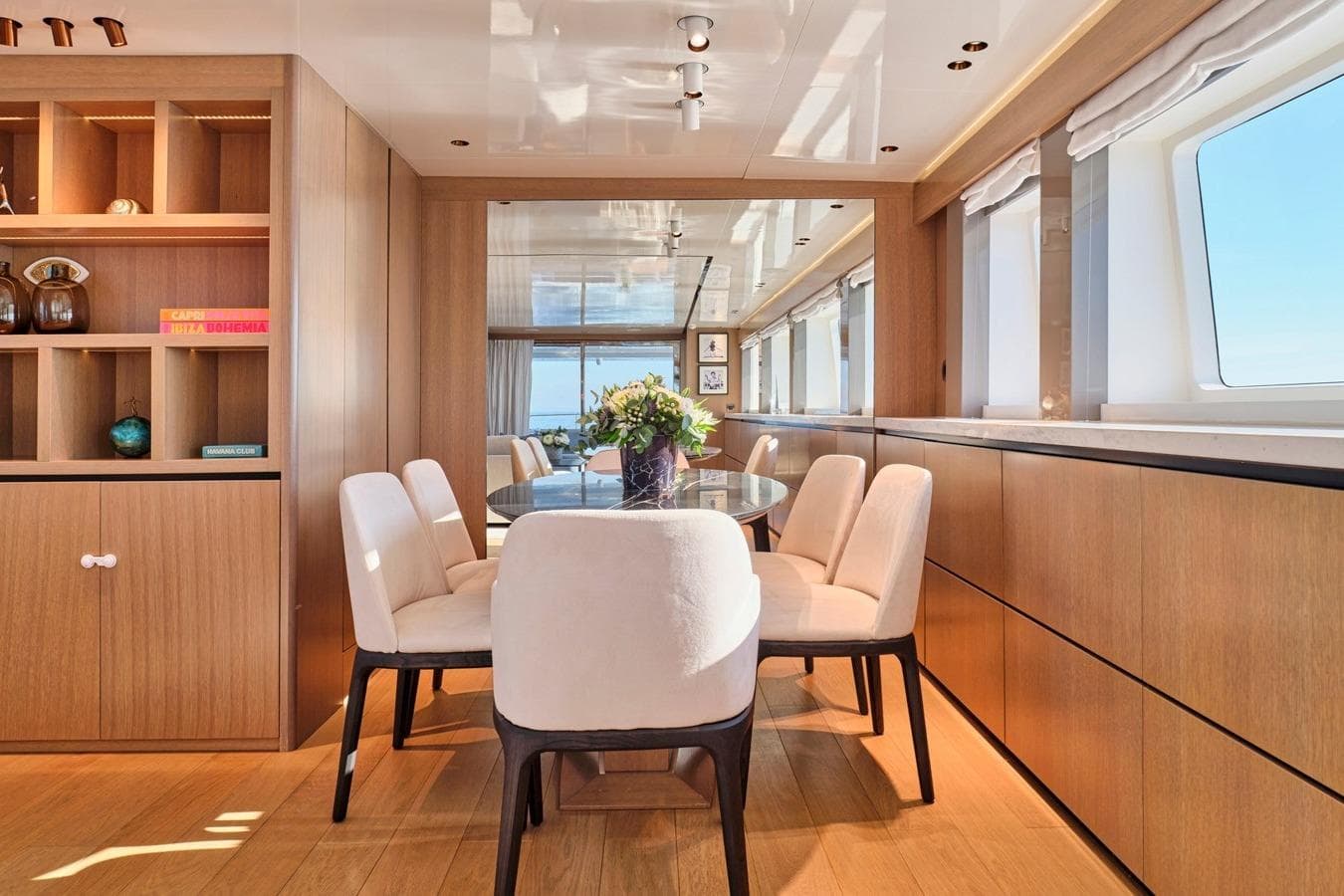 Luxurious dining area on 2008 Admiral 25 yacht with elegant decor and ocean views.