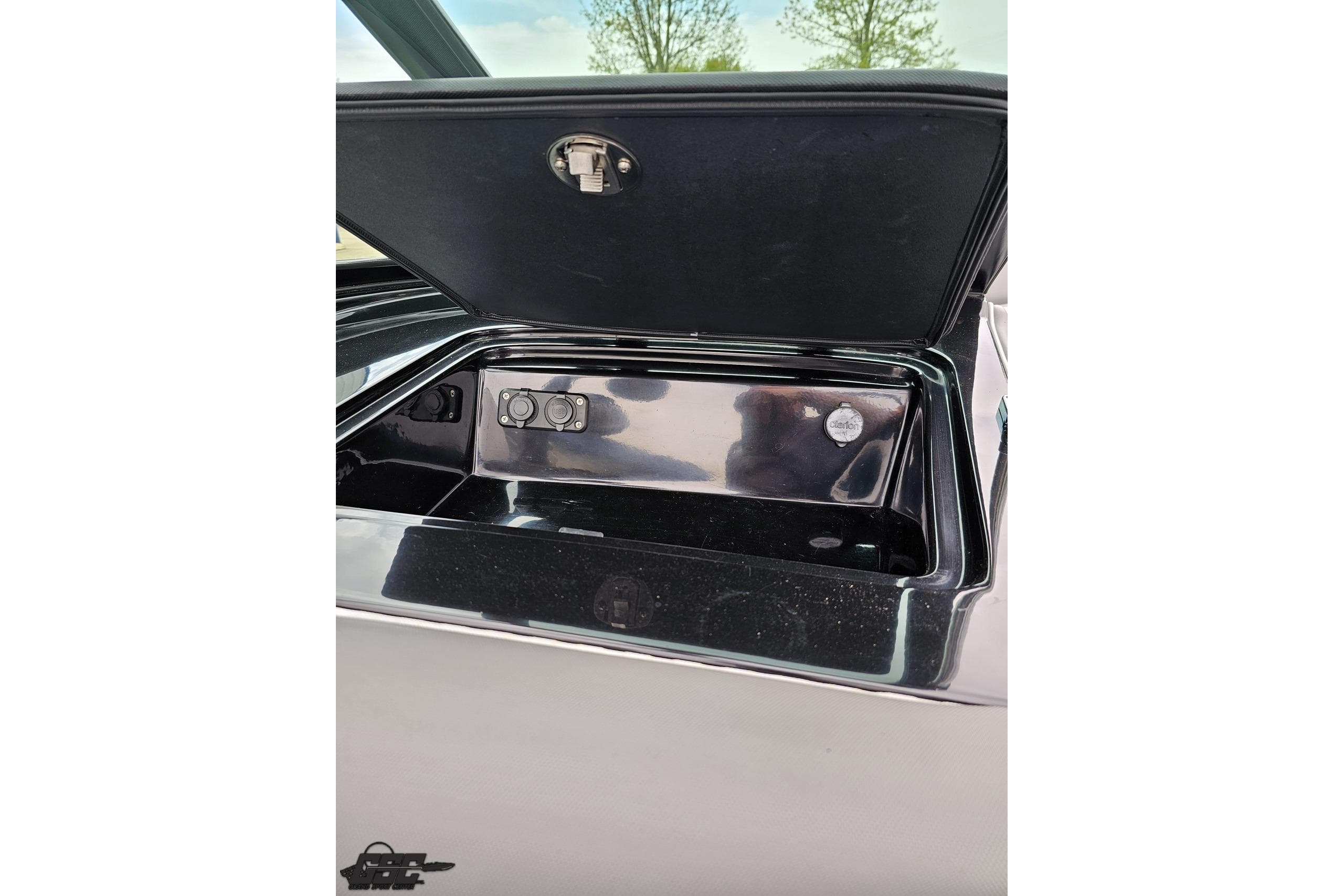 Open storage compartment in a 2018 Supreme S226 boat, showcasing interior details.