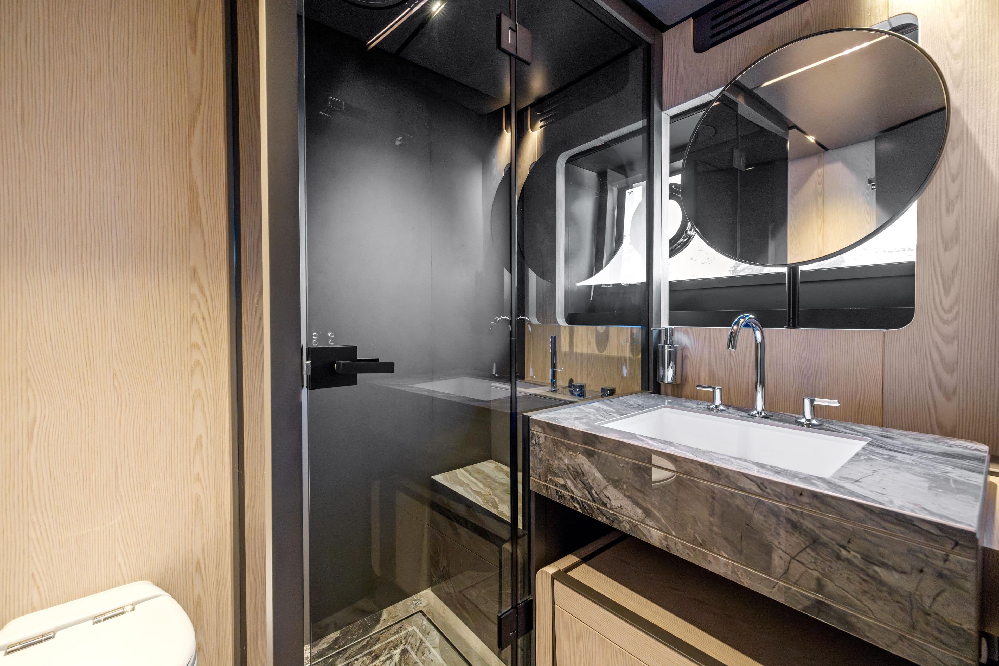 Luxurious bathroom in 2025 Ferretti Yachts INFYNITO 80, featuring modern fixtures and elegant design.