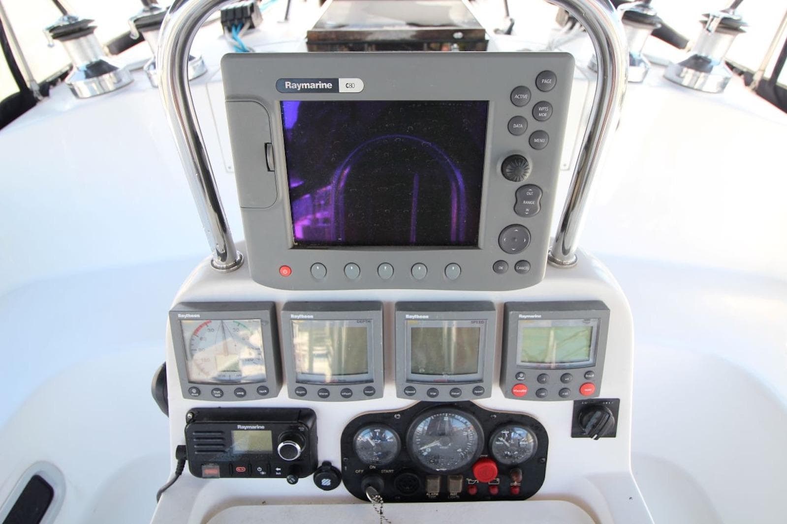 Cockpit navigation instruments on a 2000 Hunter 410 sailboat, featuring Raymarine displays.