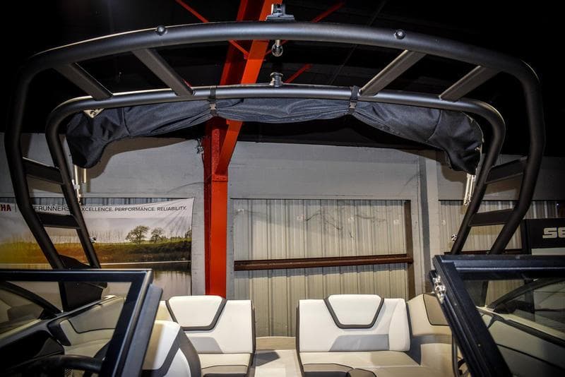 2023 Yamaha Boats AR220 interior with seating and wakeboard tower.