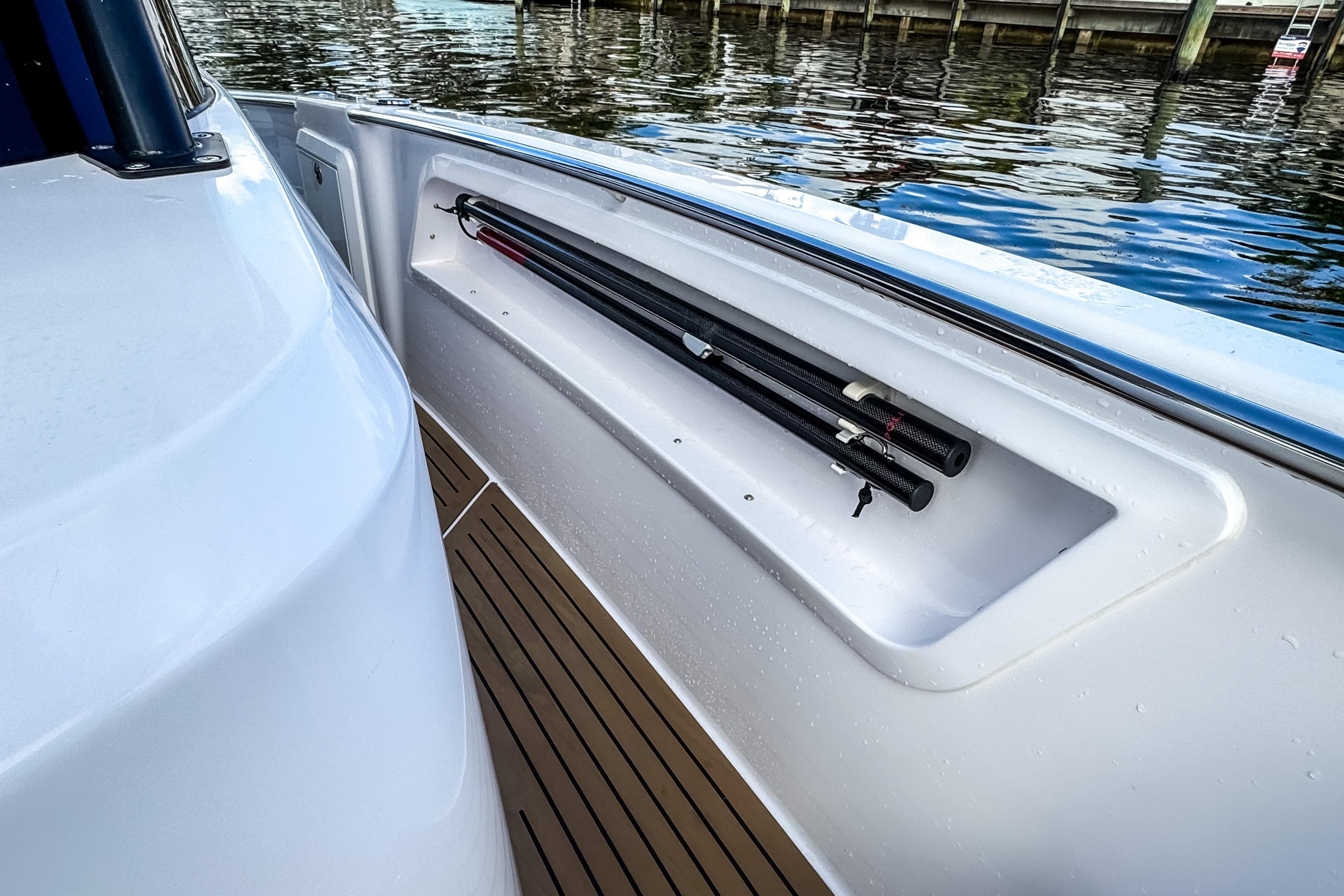 STERK 31 boat 2025 with fishing rod holder by the water.