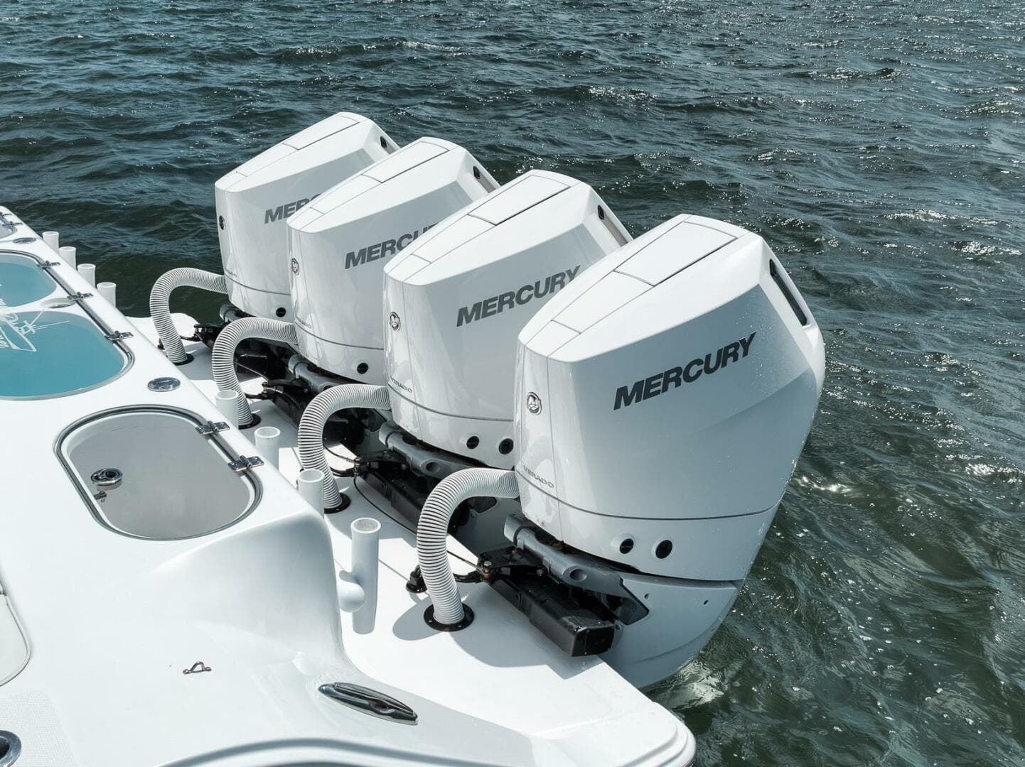 2024 Front Runner 47 Center Console with four Mercury outboard engines on the water.