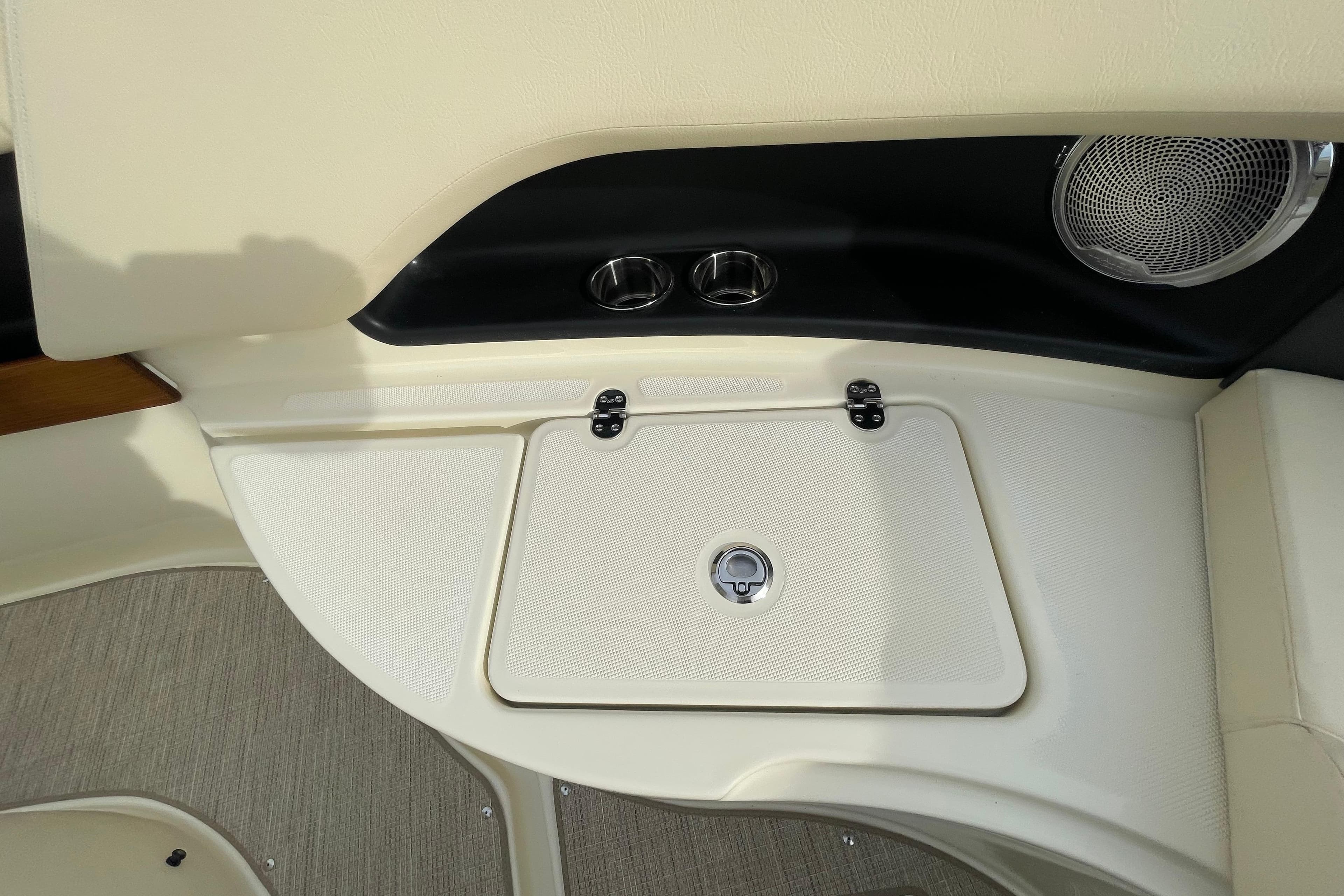 2026 Chris-Craft 310 Catalina interior detail with speaker and storage compartment.