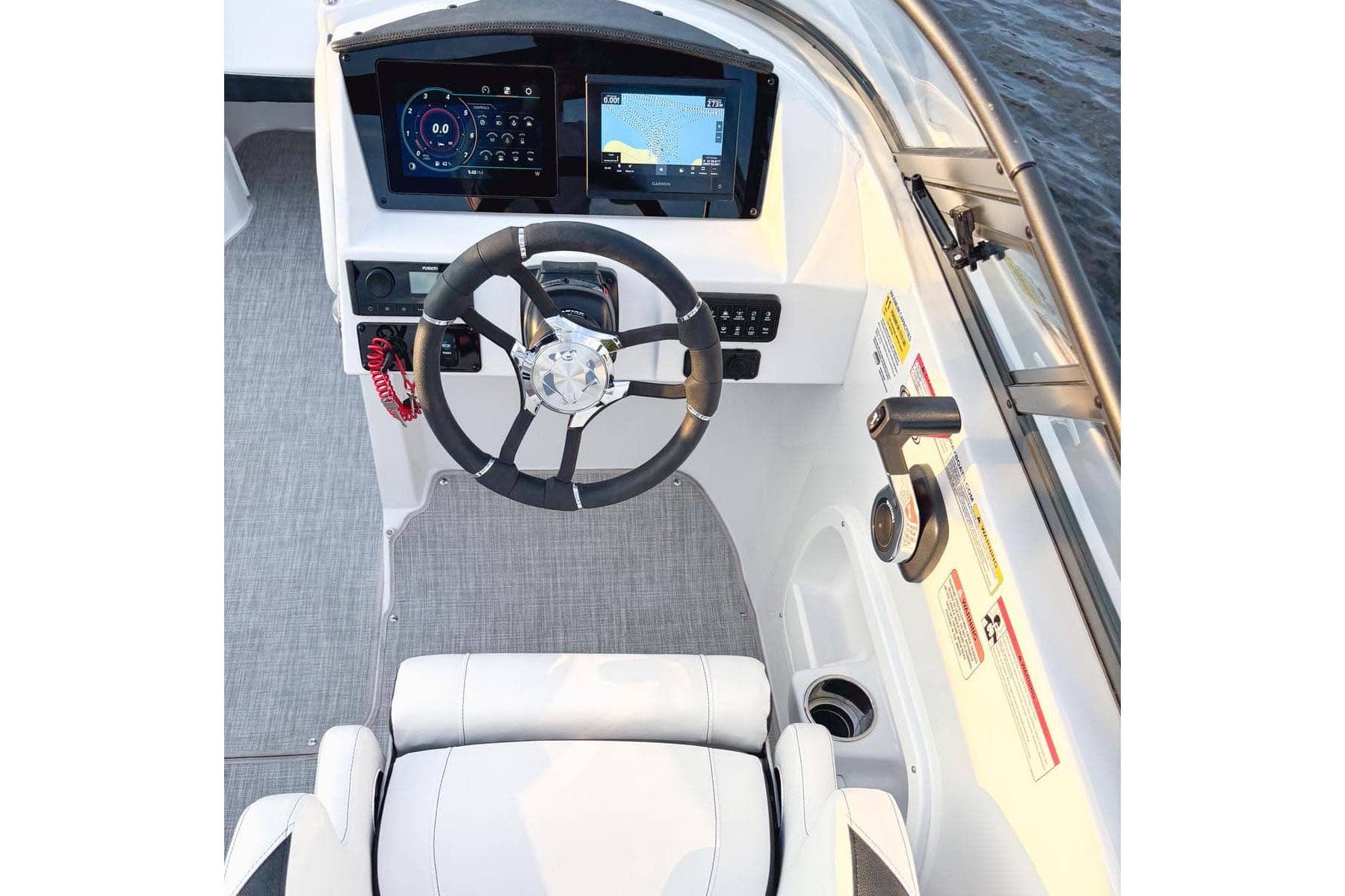 Manufacturer Provided Image: 2026 Stingray 211 DC boat cockpit with modern steering and digital displays.