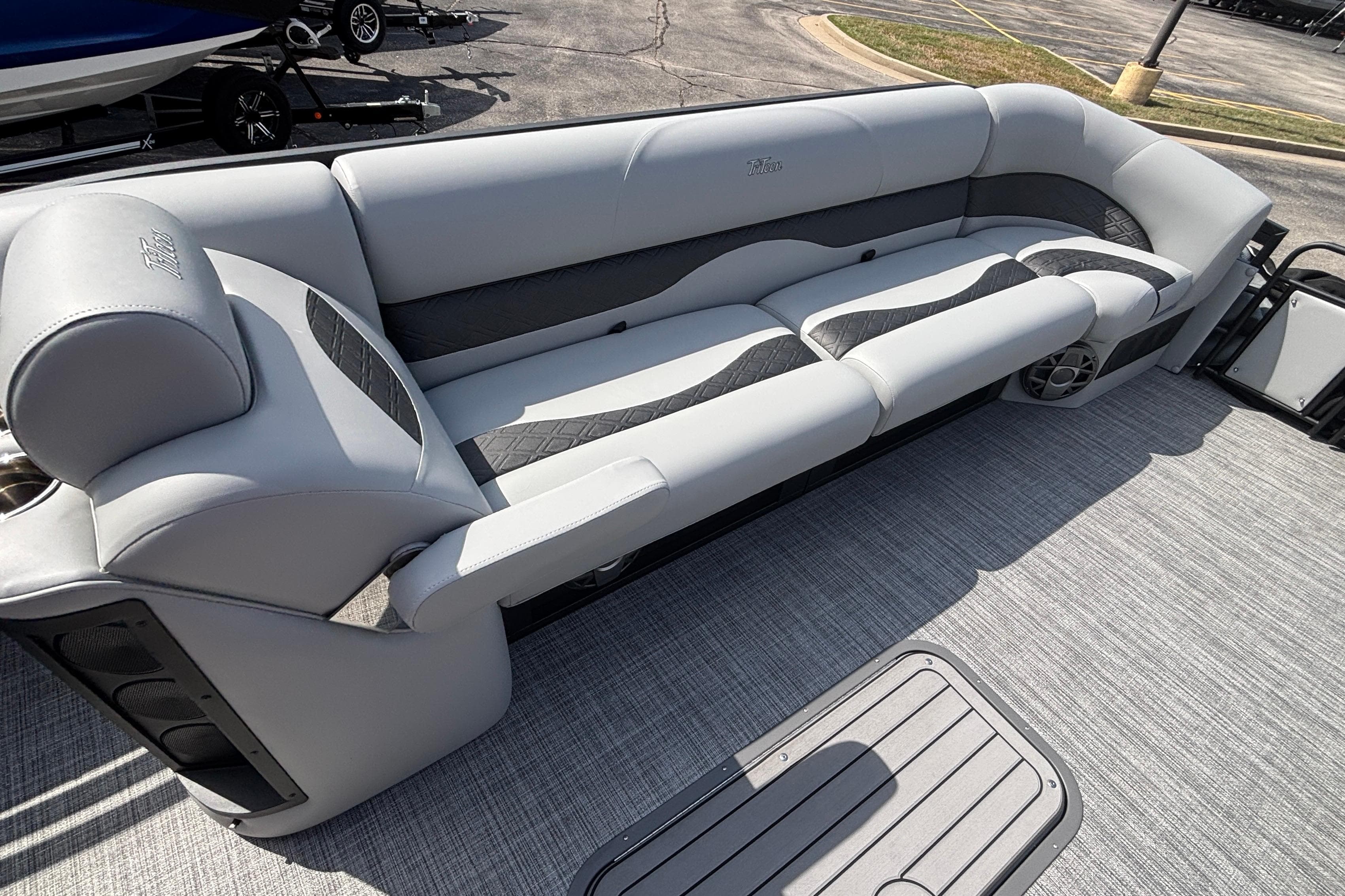 Luxurious seating on 2026 JC NEPTOON 27TT SPORT boat, featuring sleek gray upholstery.
