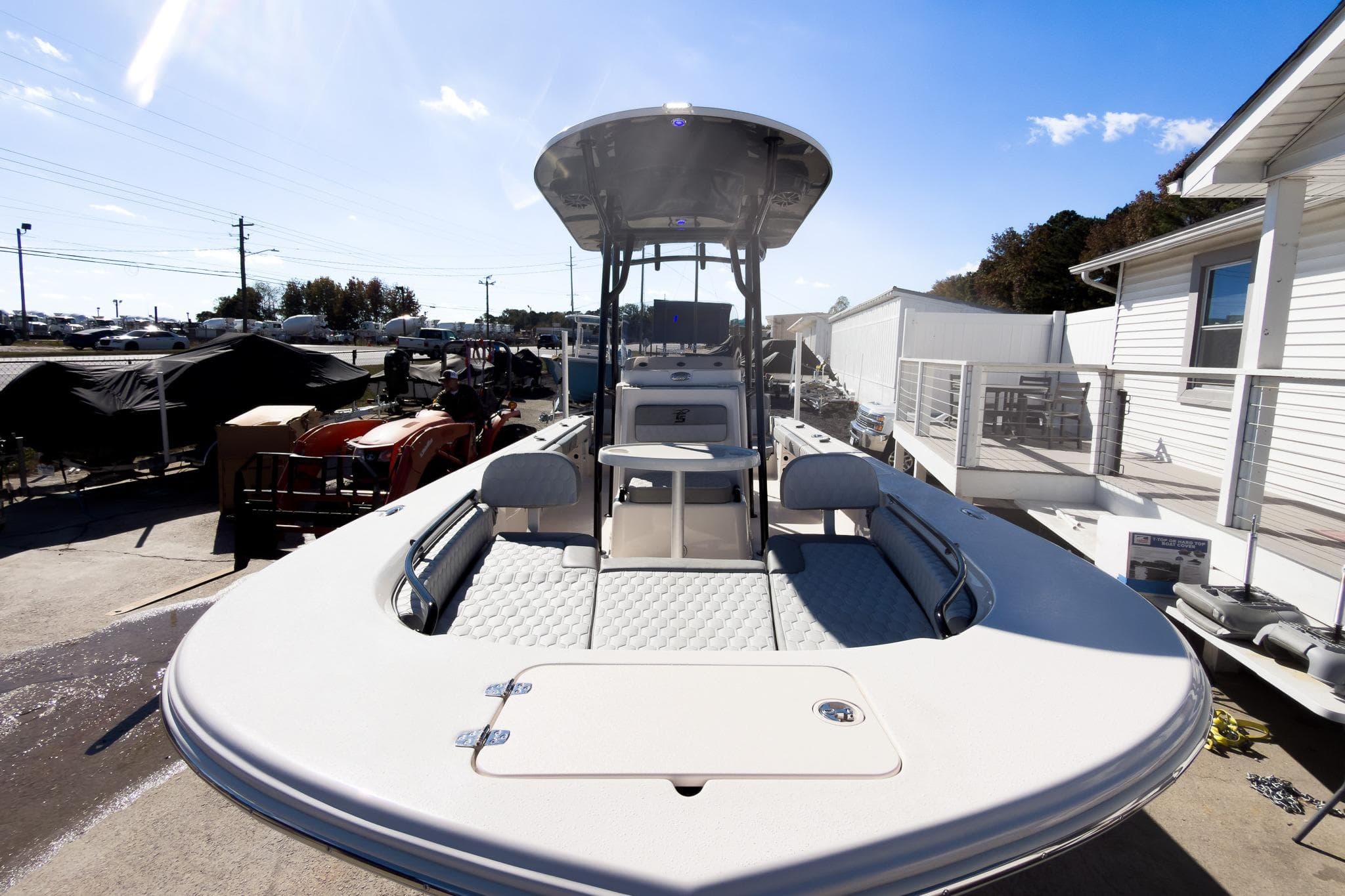 2026 Carolina Skiff 22 Ultra Elite boat docked under clear blue sky.