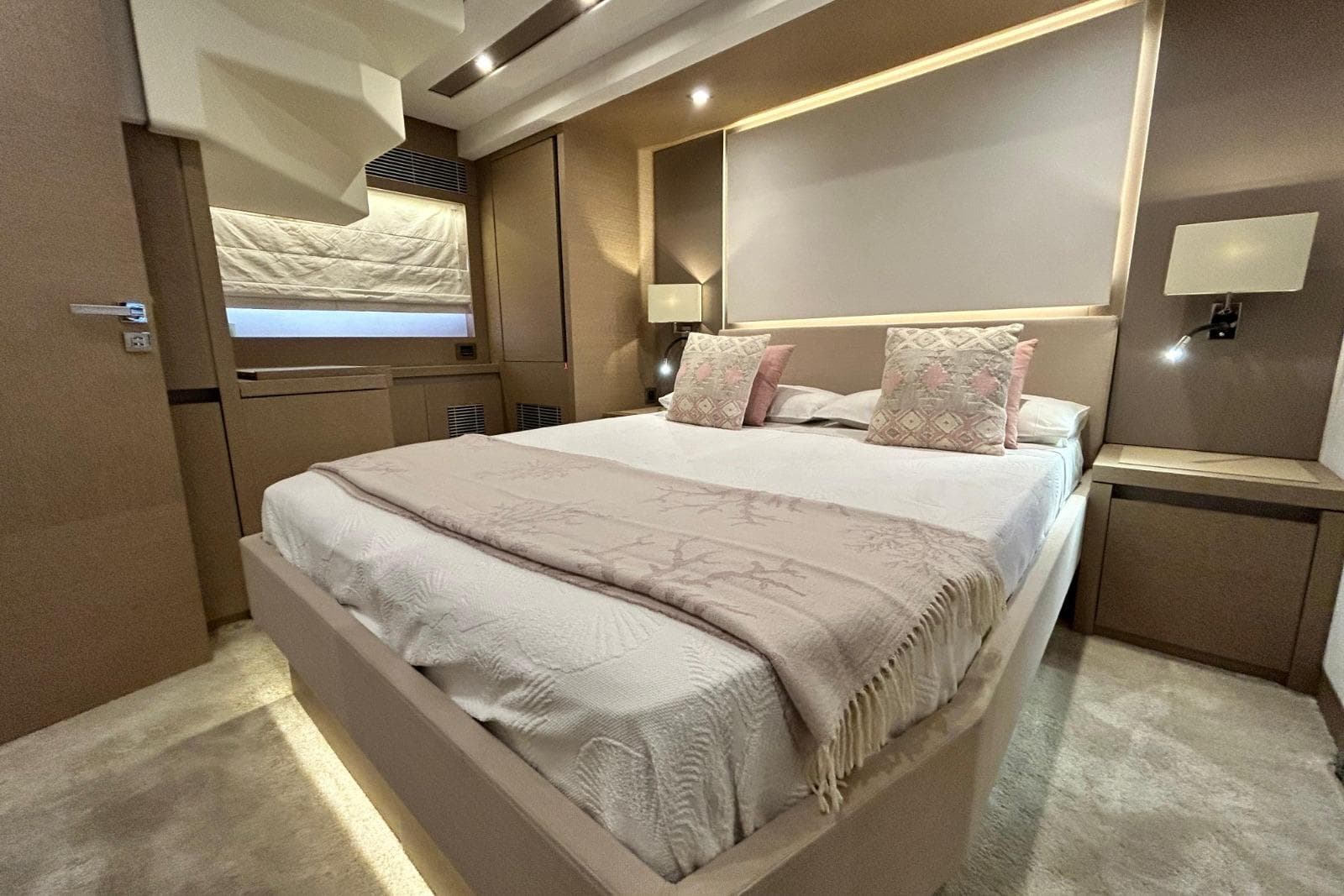Luxurious bedroom interior of 2017 Prestige 680 yacht with elegant decor and ambient lighting.