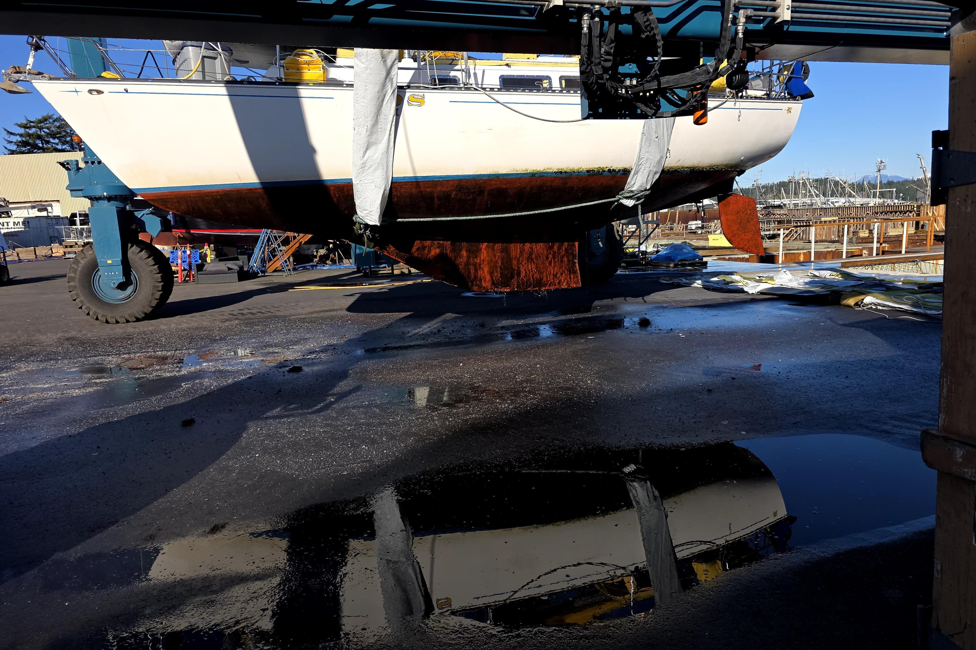 1978 Ontario Yachts Ontario 32 sailboat lifted for maintenance at a marina.