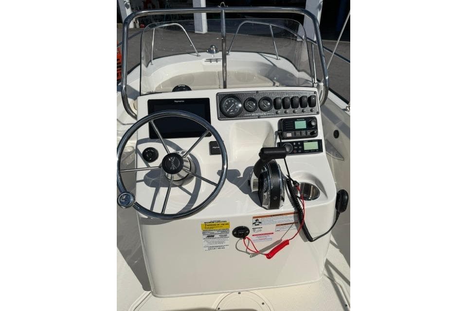 2021 Boston Whaler 170 Montauk boat console with steering wheel and gauges.