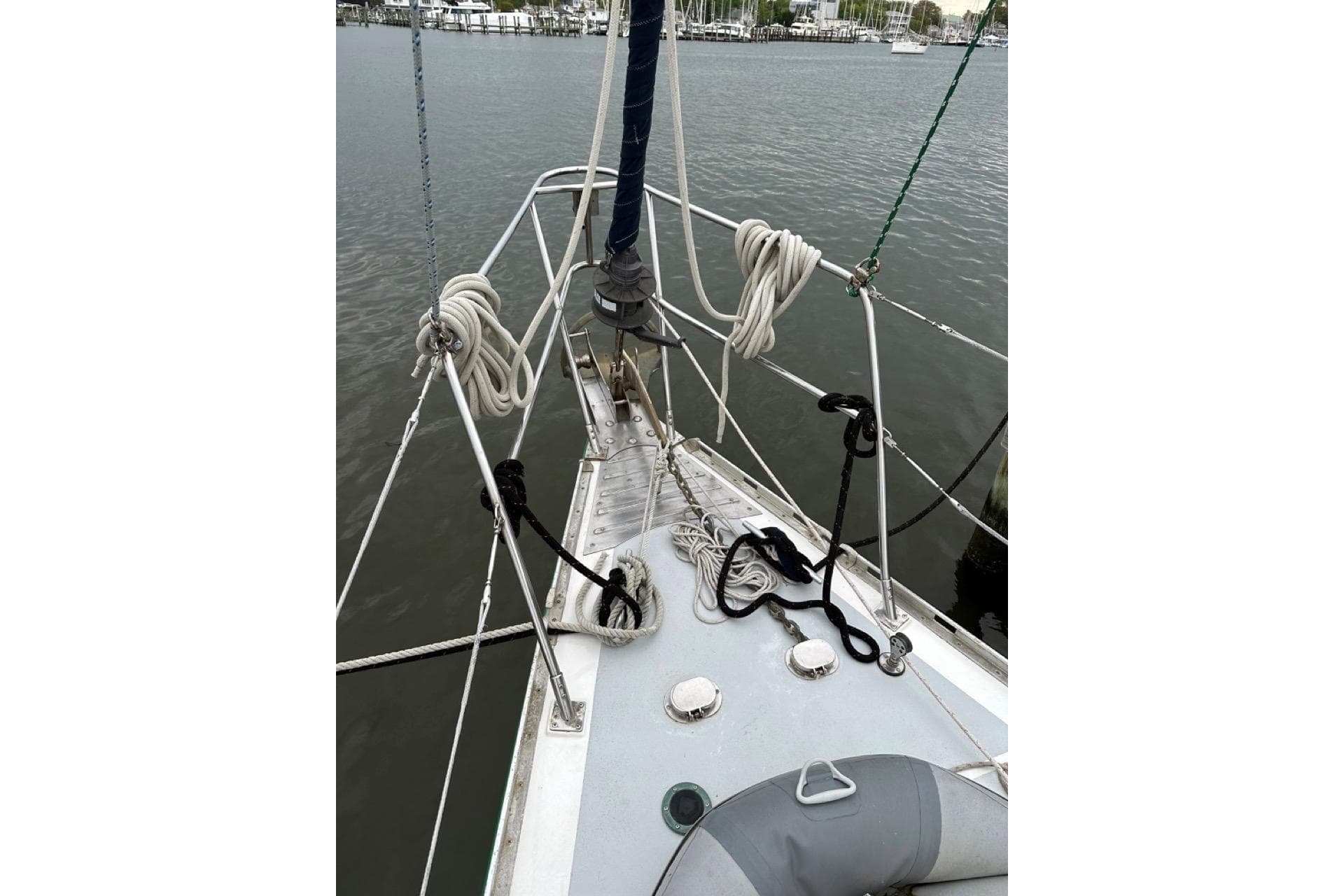 Bow of 1989 Hylas 44 sailboat with ropes and fittings on deck.