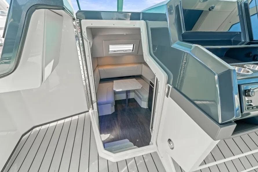 2024 Formula 380 Super Sport Crossover OB cabin interior with modern seating and table.