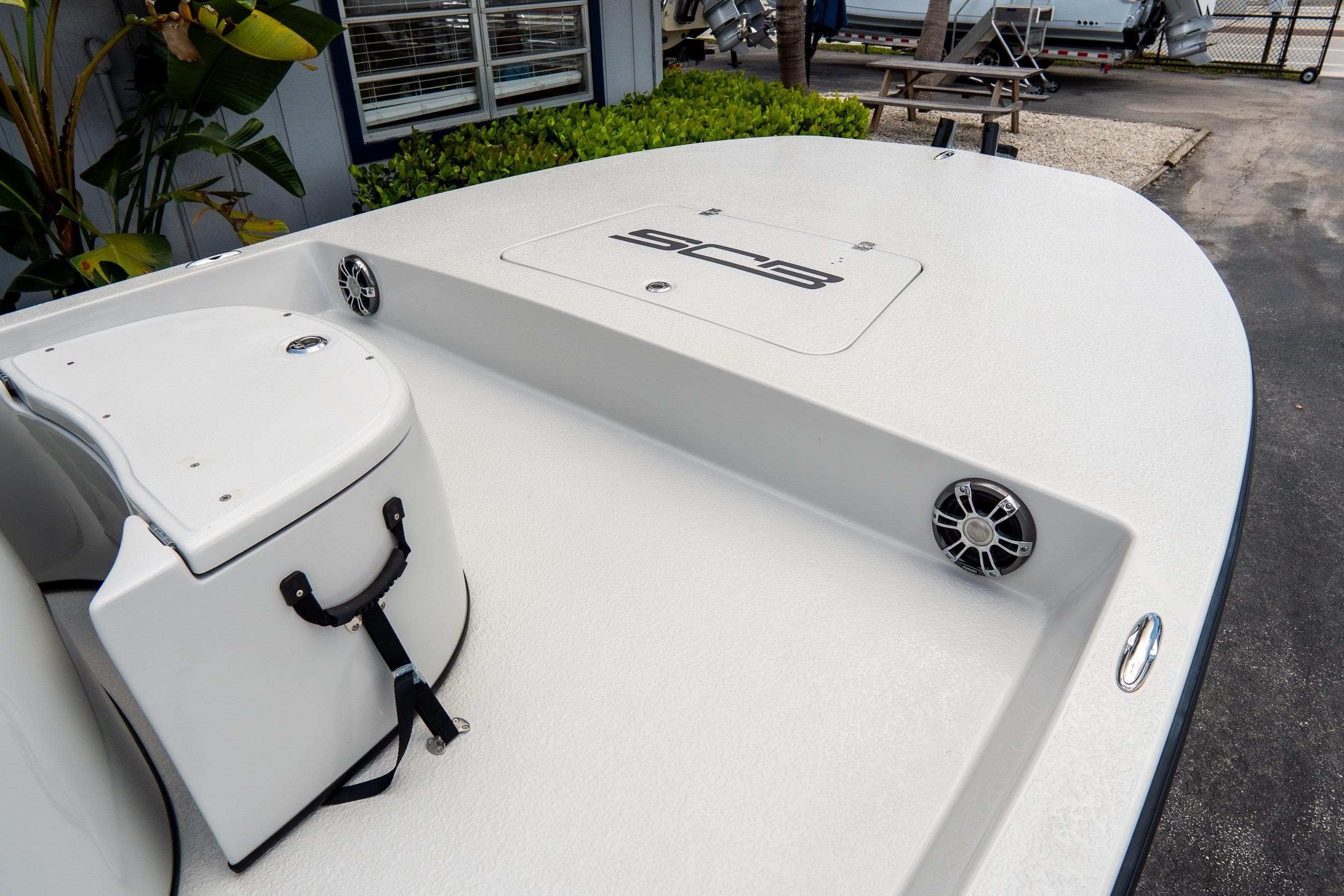 2021 SCB S22 boat deck with storage compartment and speakers.