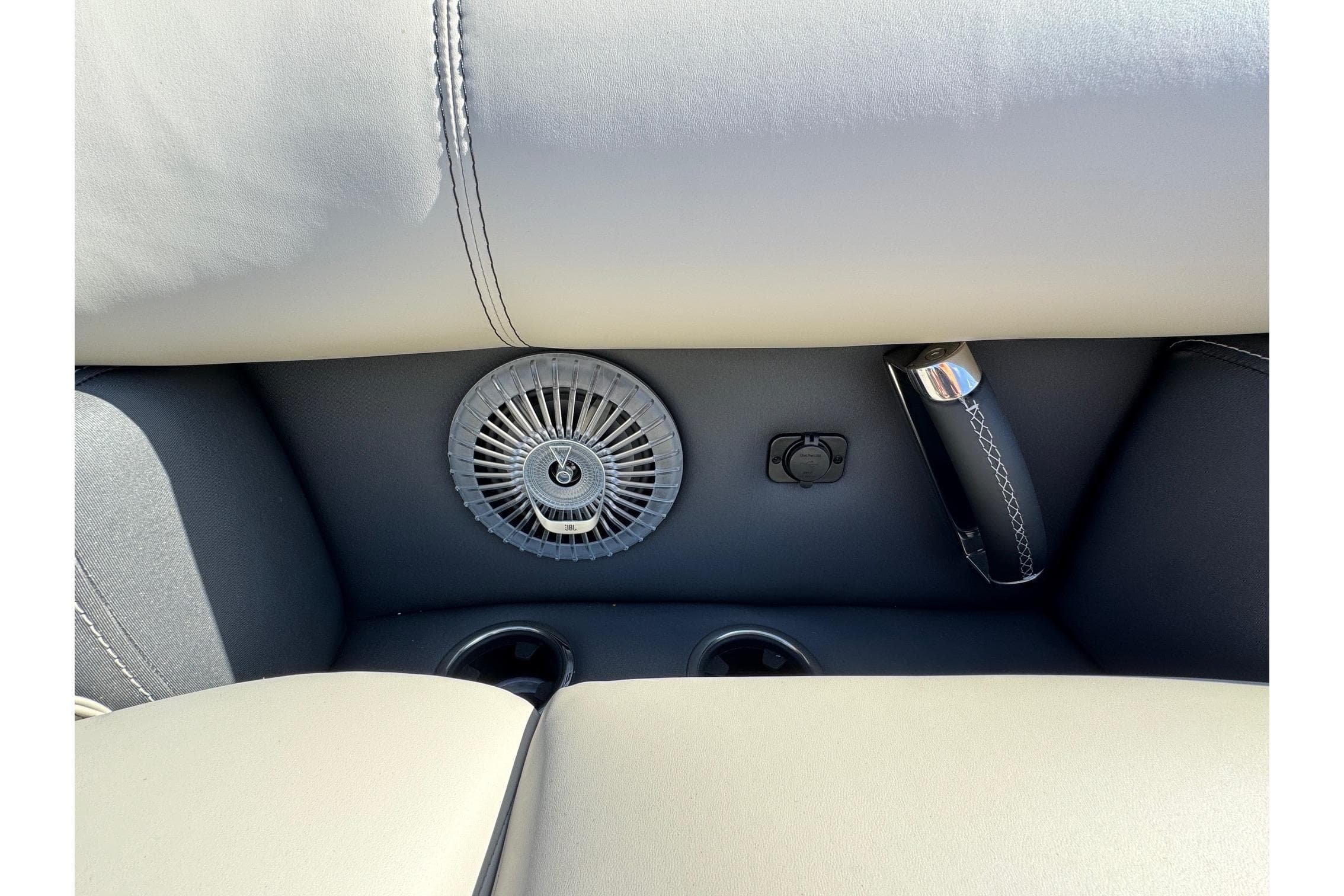 Barletta Lusso 23UC 2026 interior detail with speaker, handle, and cup holders.
