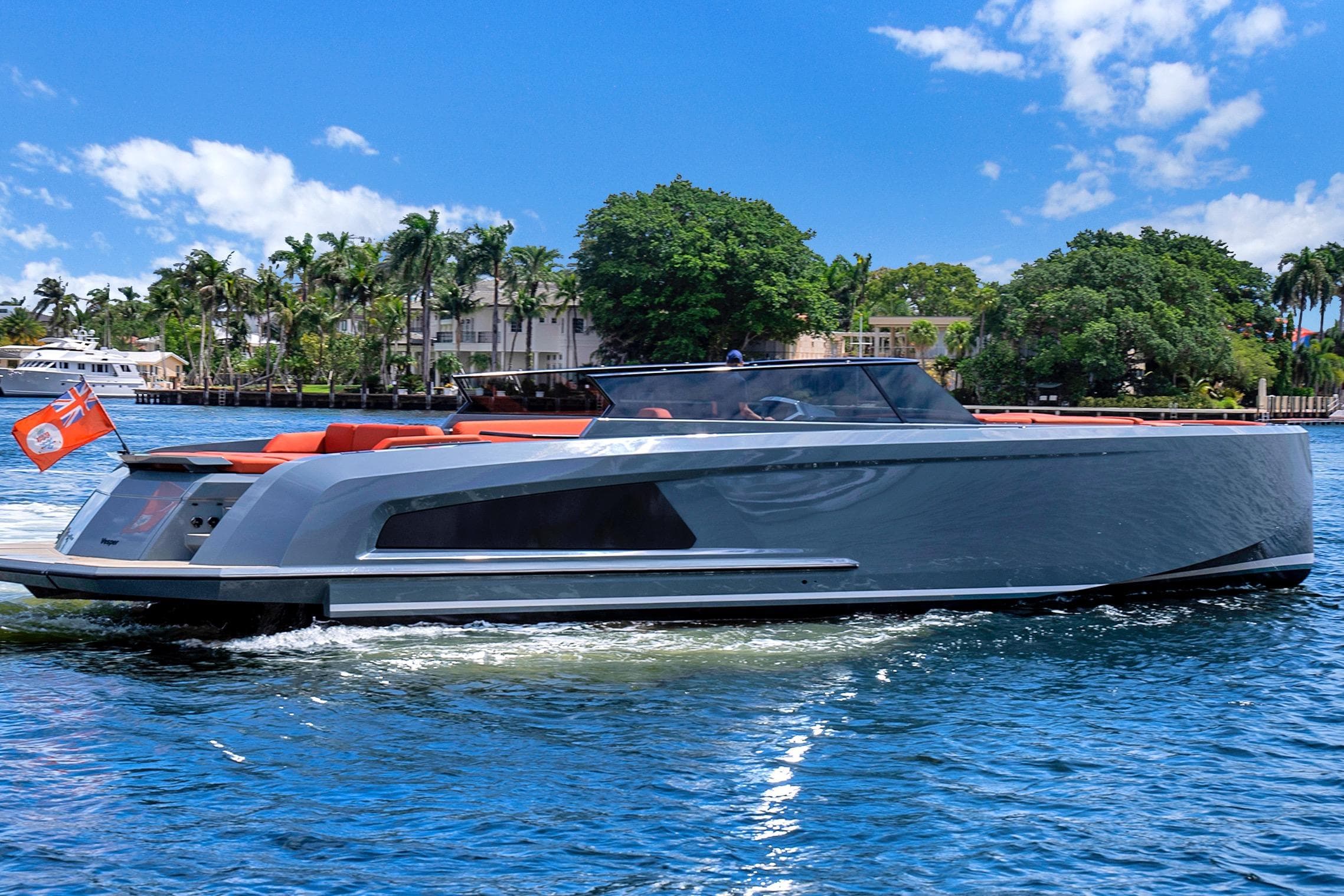 2017 Vanquish Yachts VQ 54 luxury yacht cruising on a sunny day.