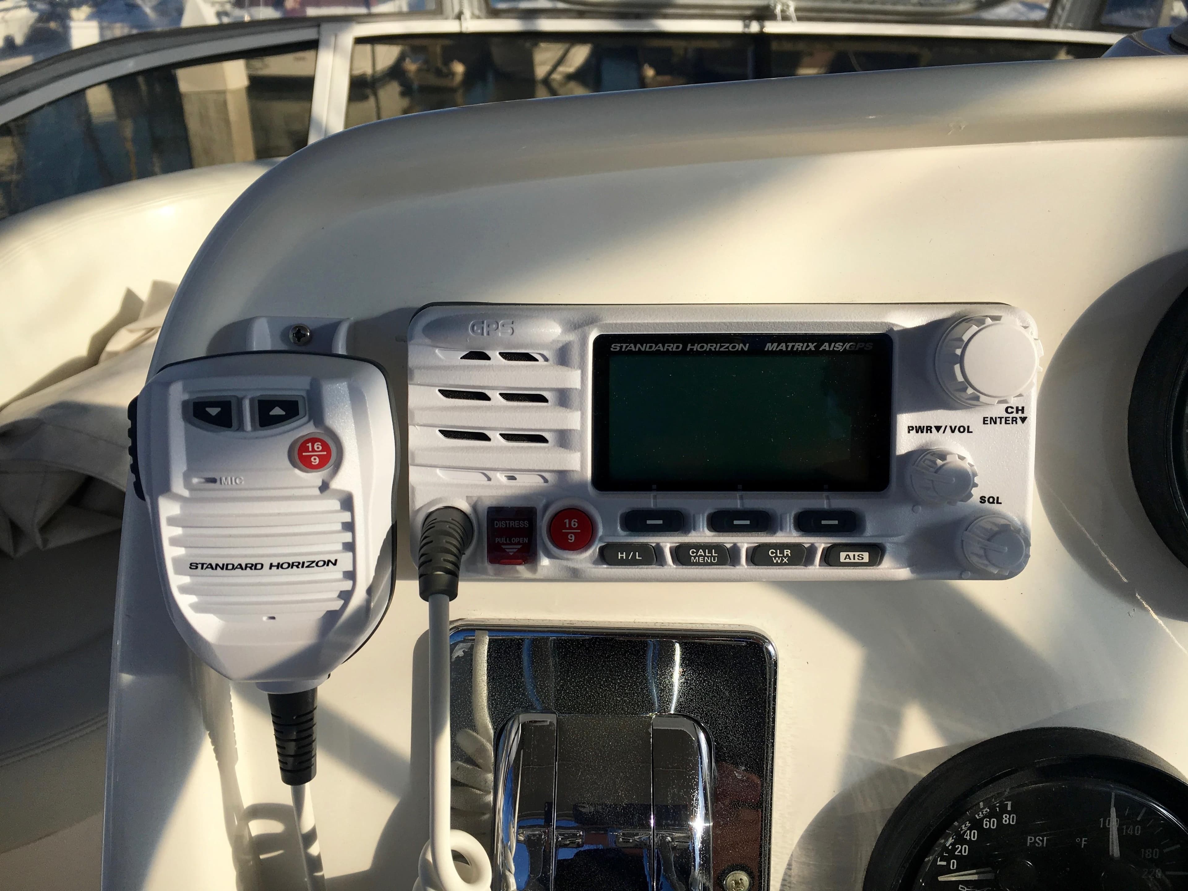 1999 Silverton 351 Sedan boat control panel with radio.