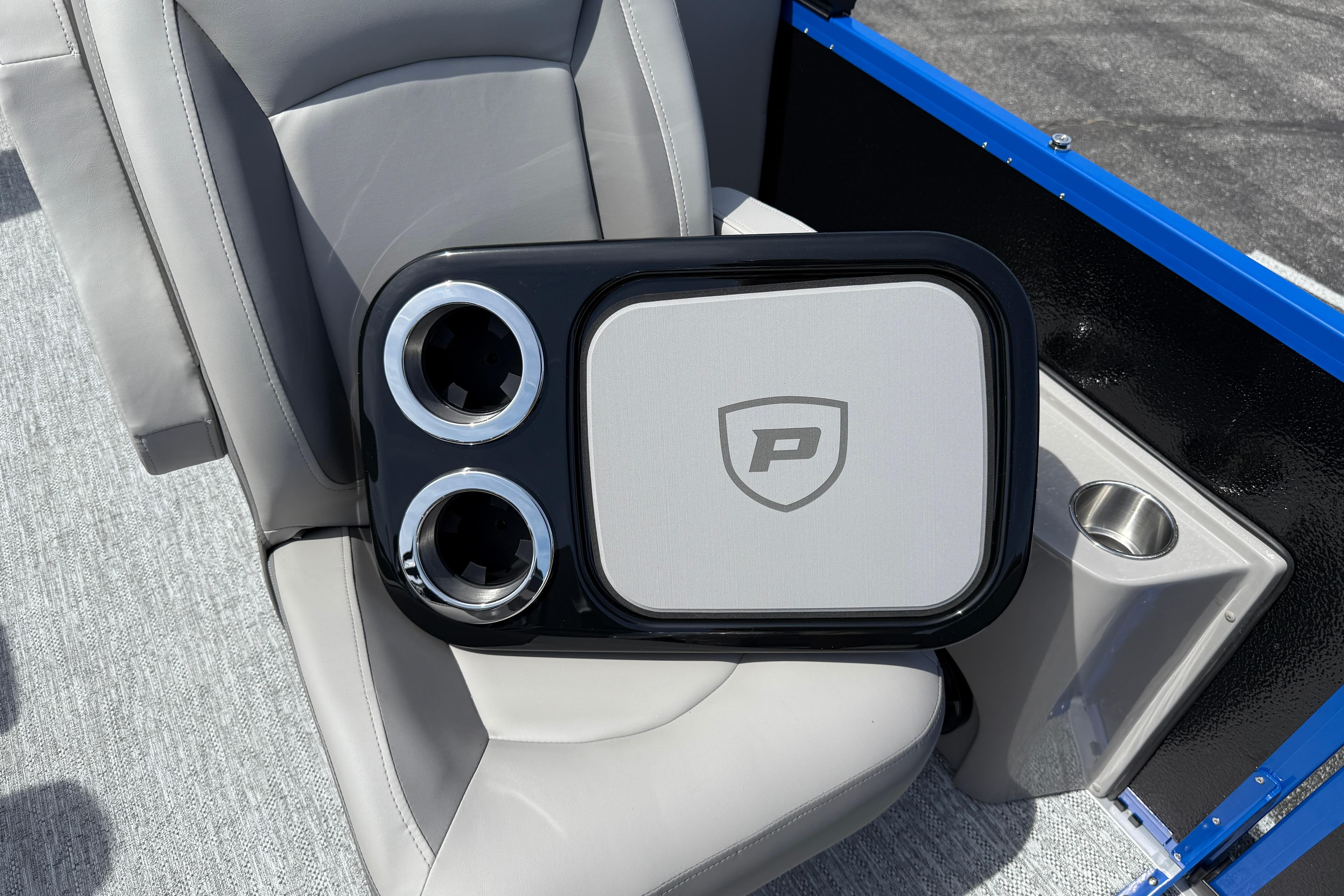 2026 Premier 230 SunSation RF boat interior with cup holders and logo detail.