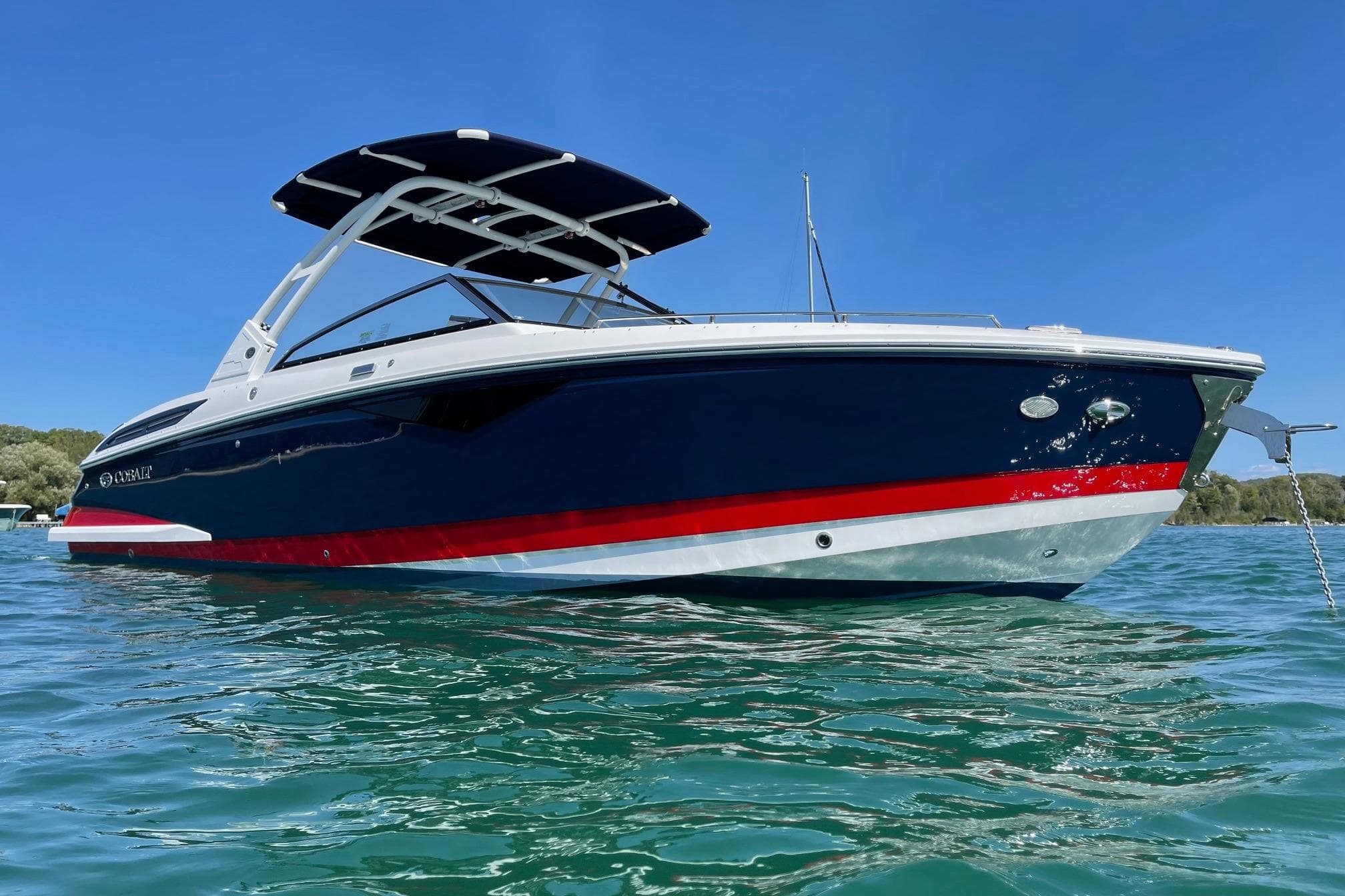 2021 Cobalt A29 boat on clear blue water under a sunny sky.