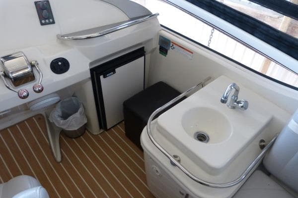 2009 Carver 41 Cockpit Motor Yacht interior with sink and mini fridge.