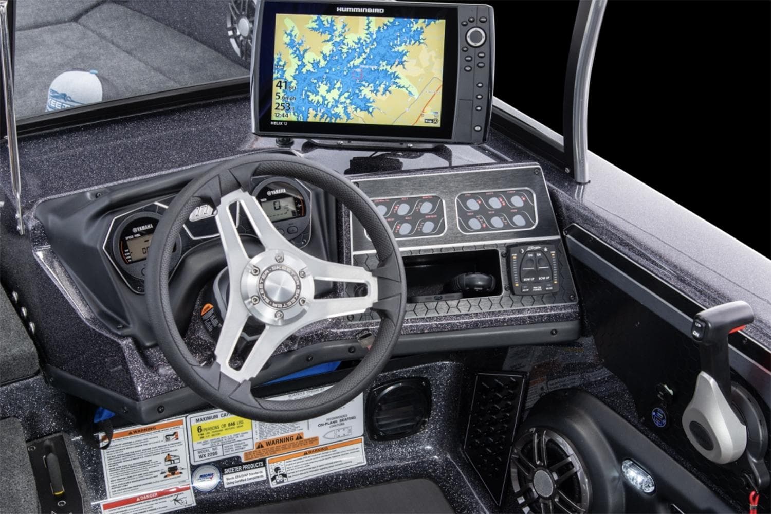 Manufacturer Provided Image: 2025 Skeeter WX2200 boat dashboard with steering wheel and navigation display.