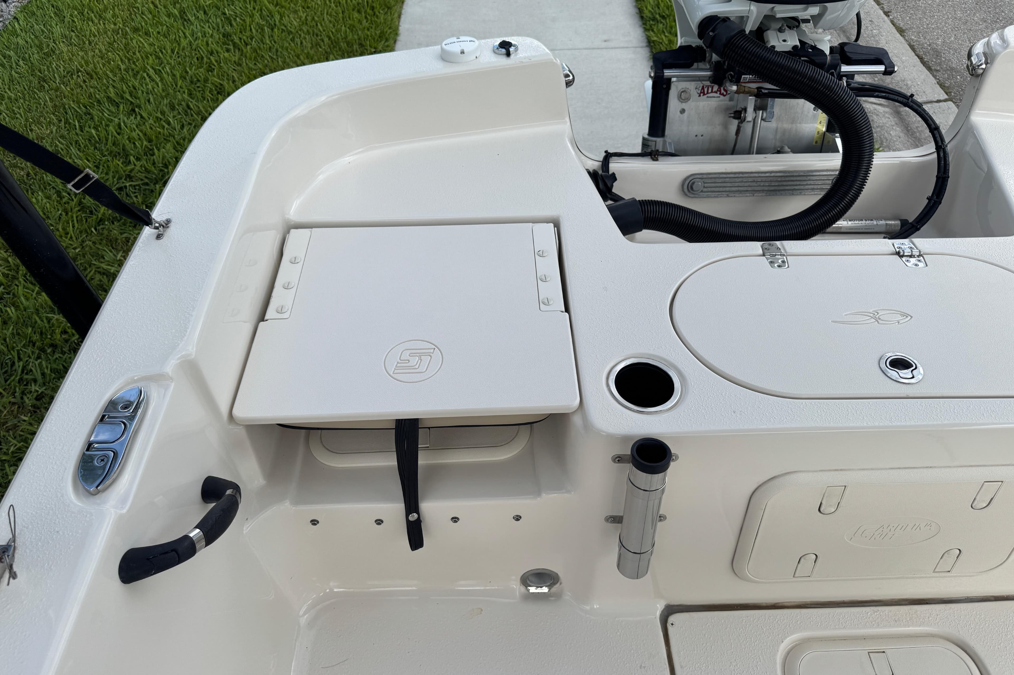 2022 Carolina Skiff 19 LS boat interior with storage compartments and motor details.